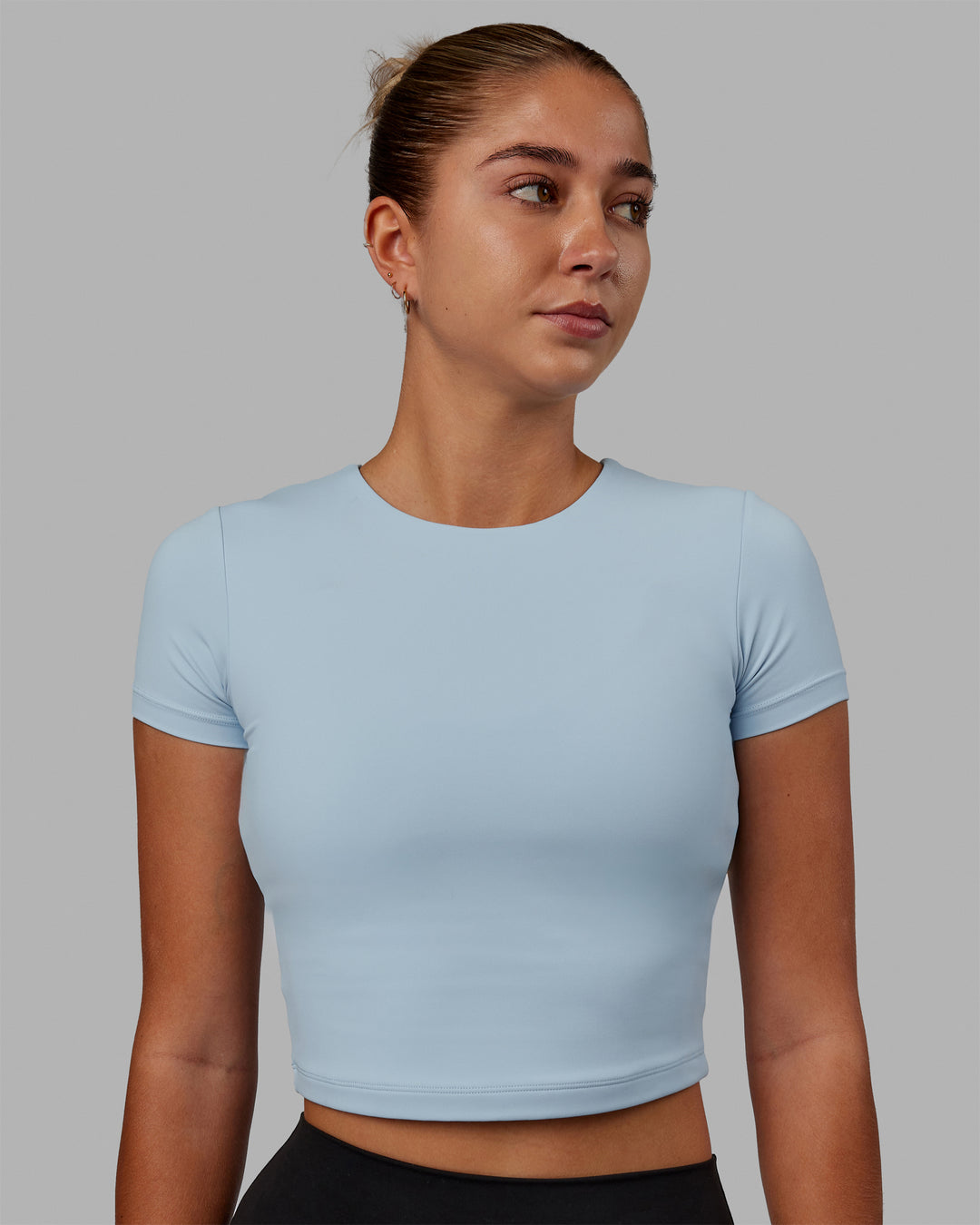 Woman wearing Staple Cropped Tee - Glacial Blue