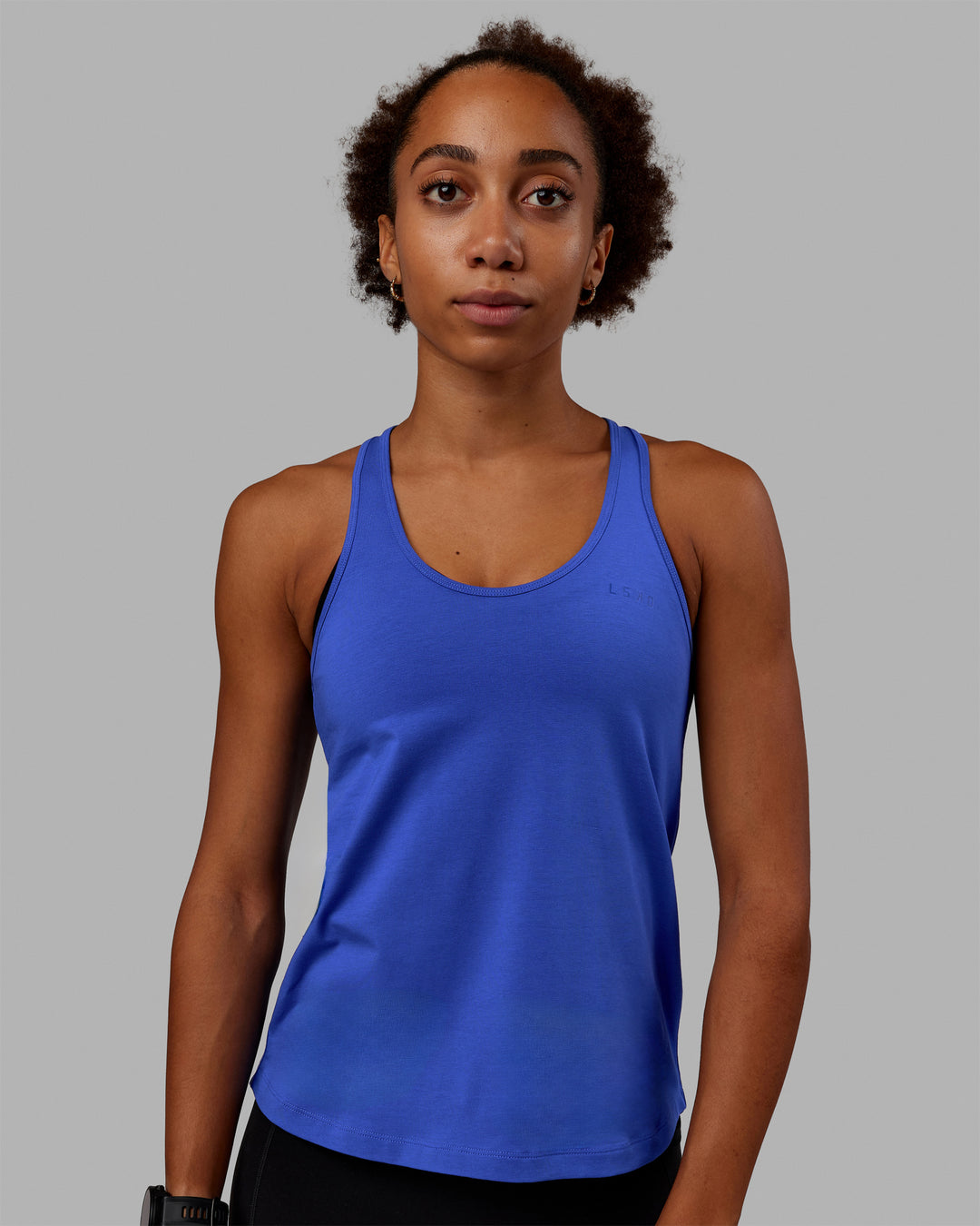 Woman wearing Static PimaFLX-Lite Tank - Power Cobalt