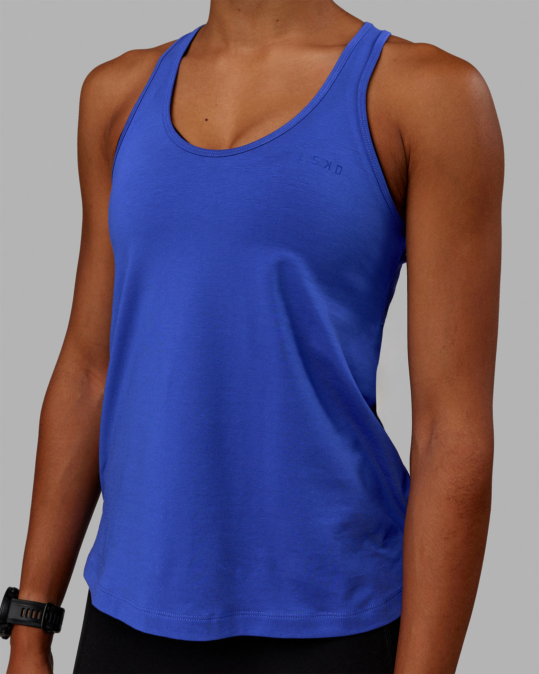 Woman wearing Static PimaFLX-Lite Tank - Power Cobalt