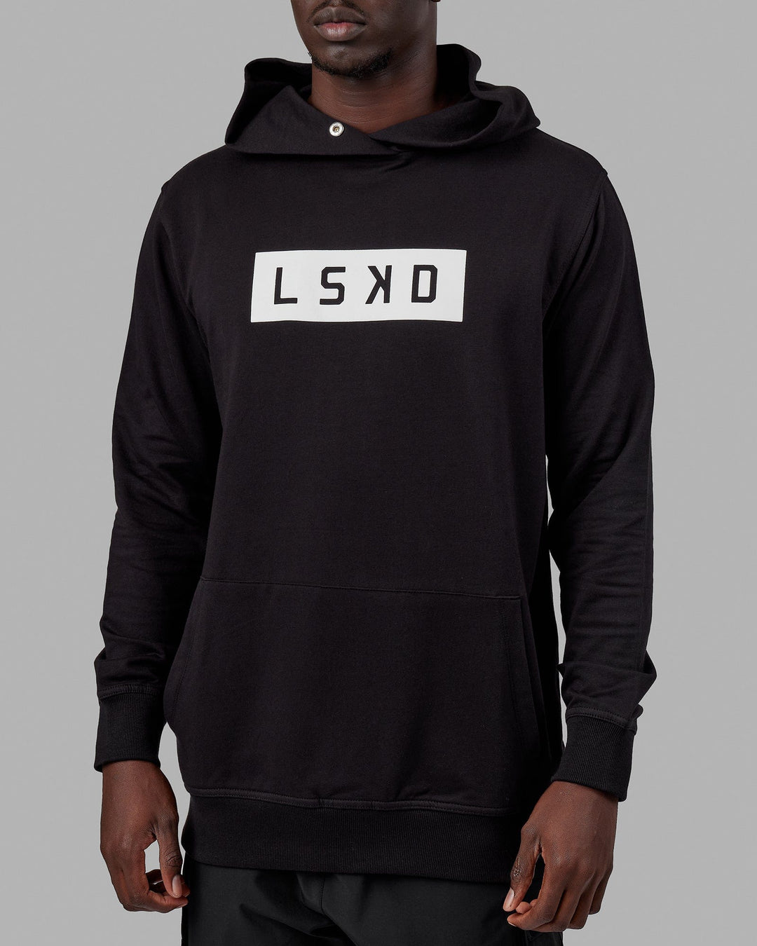 Man wearing Unisex Strength FLXFLeece Hoodie - Black-White