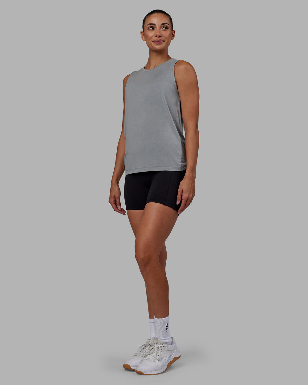 Woman wearing Swivel Open Back Tank - Circular Grey