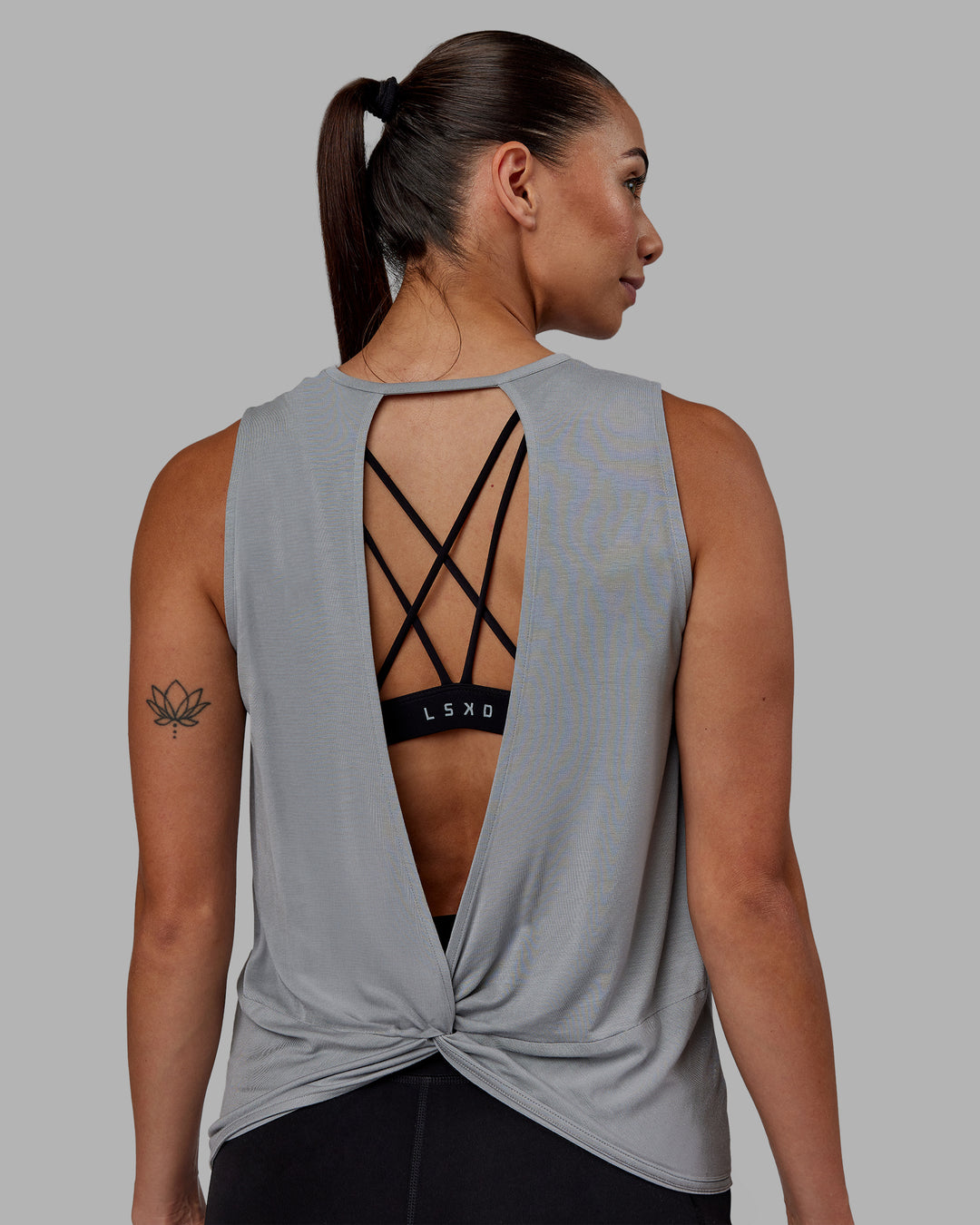 Woman wearing Swivel Open Back Tank - Circular Grey