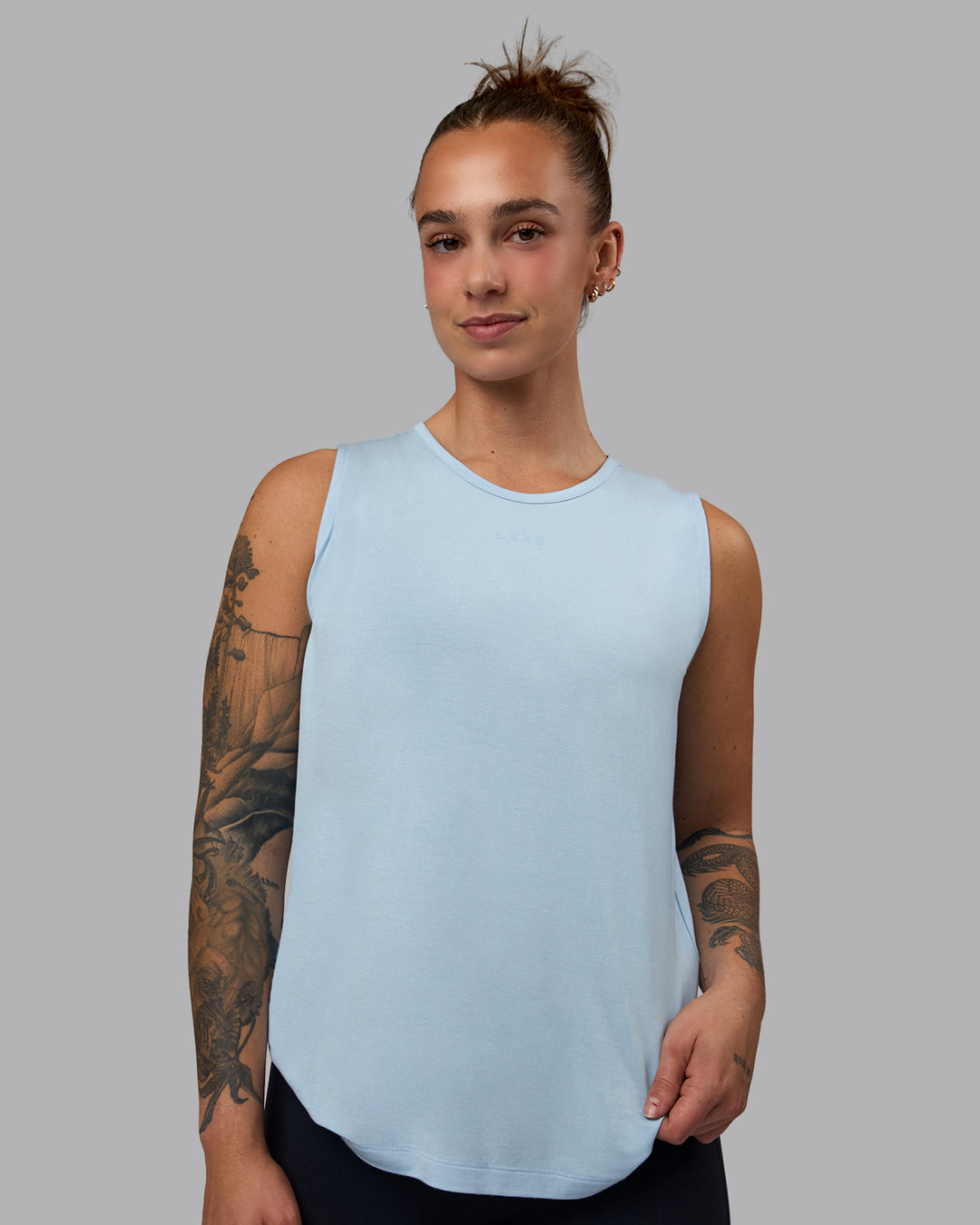 Woman wearing Swivel Open Back Tank - Glacial Blue