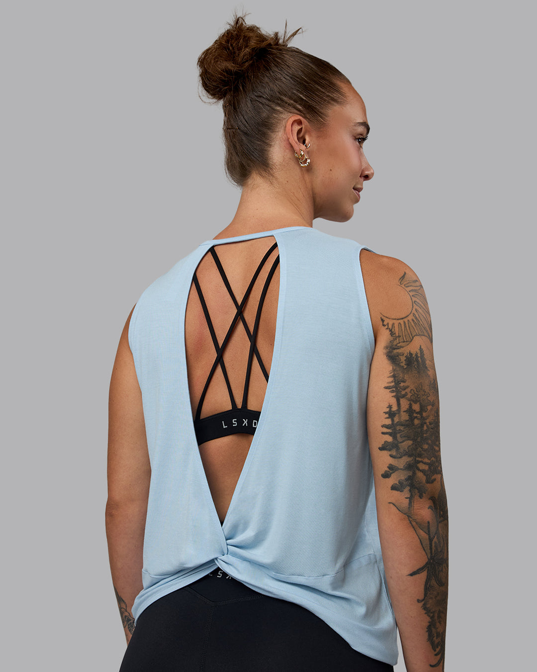 Woman wearing Swivel Open Back Tank - Glacial Blue