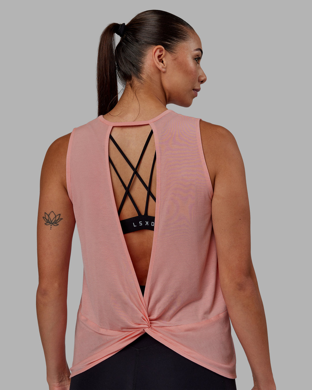 Woman wearing Swivel Open Back Tank - Murex Shell