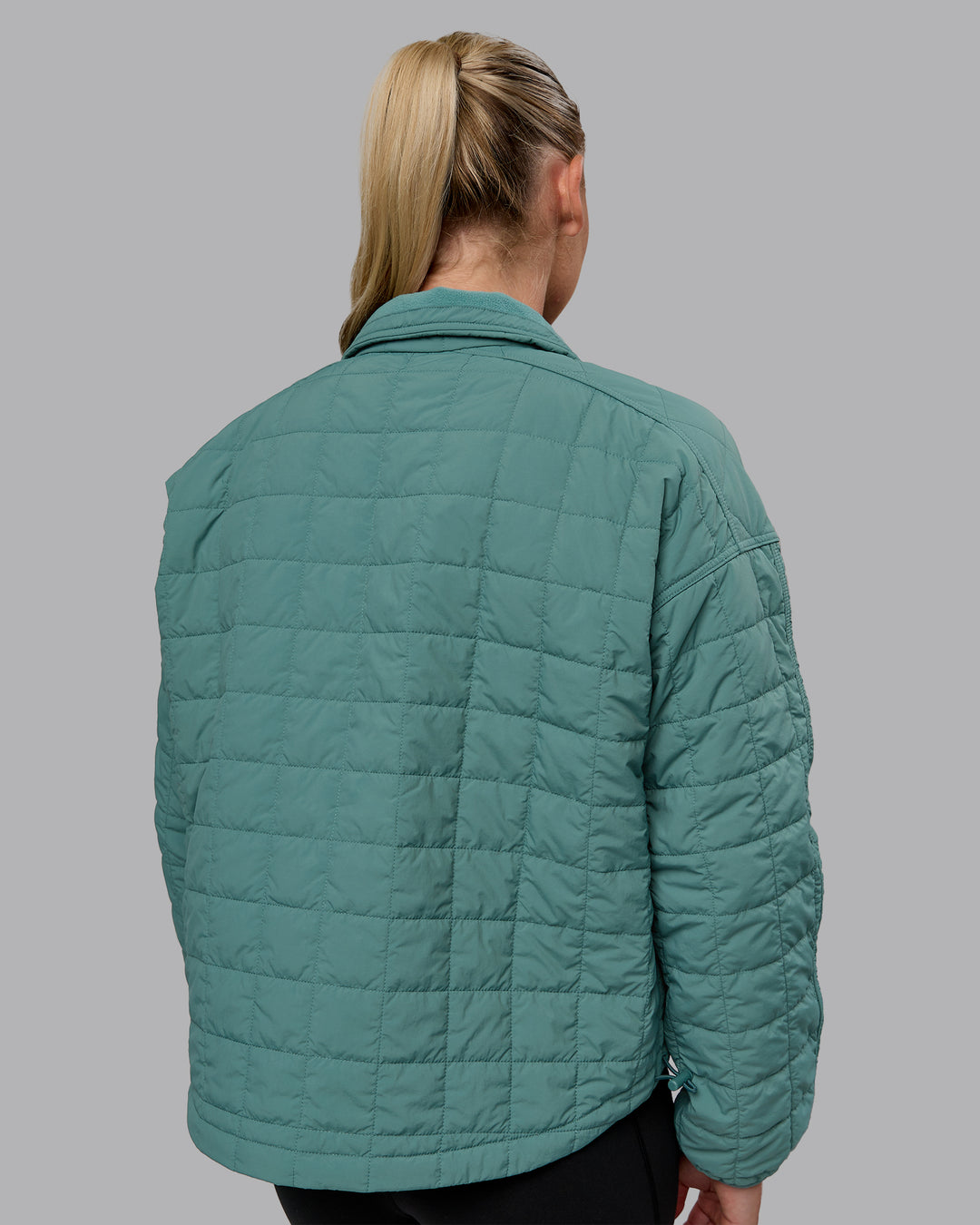 Woman wearing Thrive Packable Jacket - Sagebush