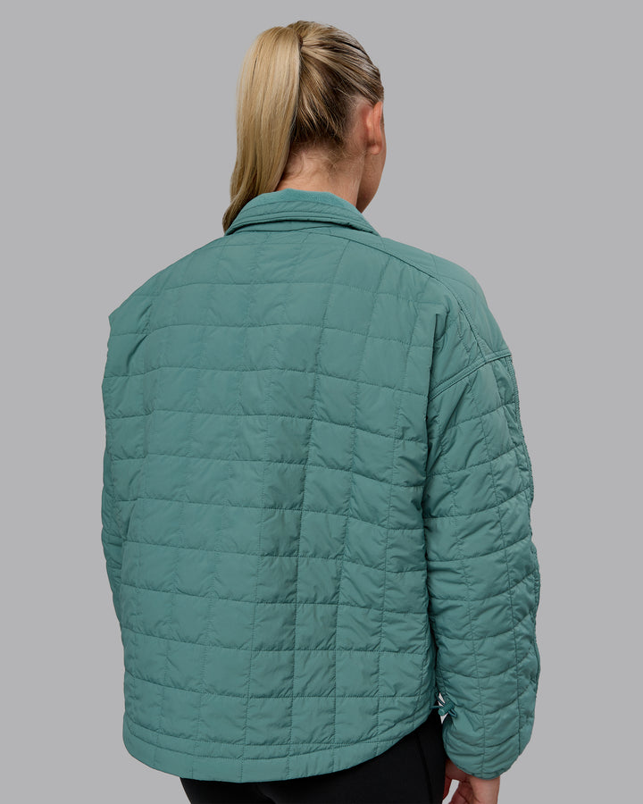 Woman wearing Thrive Packable Jacket - Sagebush
