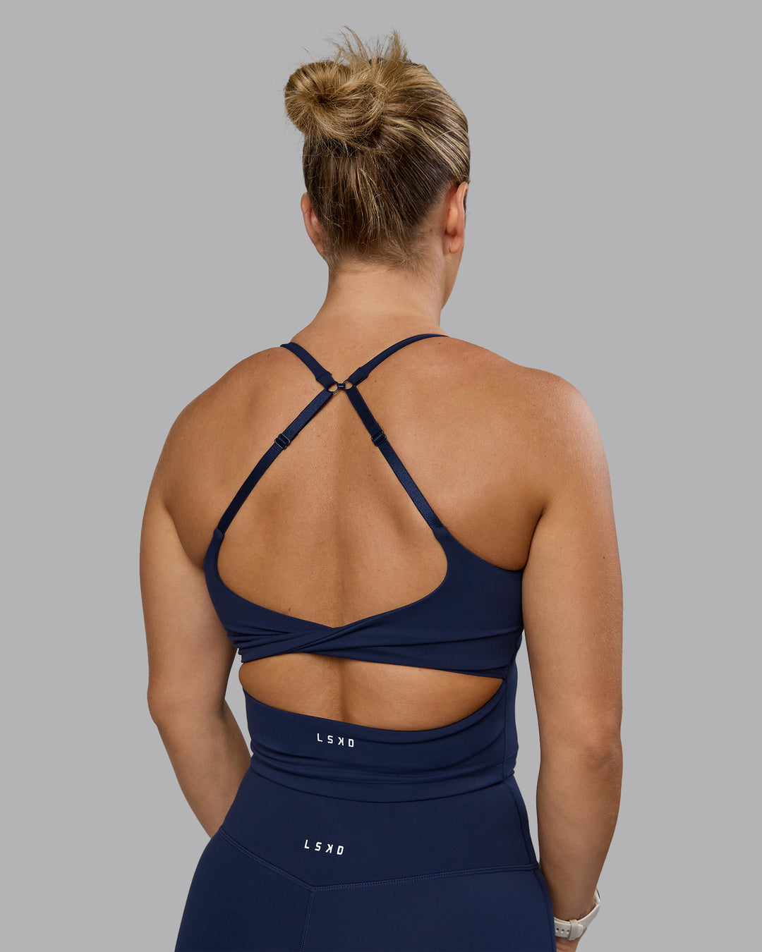 Woman wearing Twist Shelf Bra Tank - Future Navy