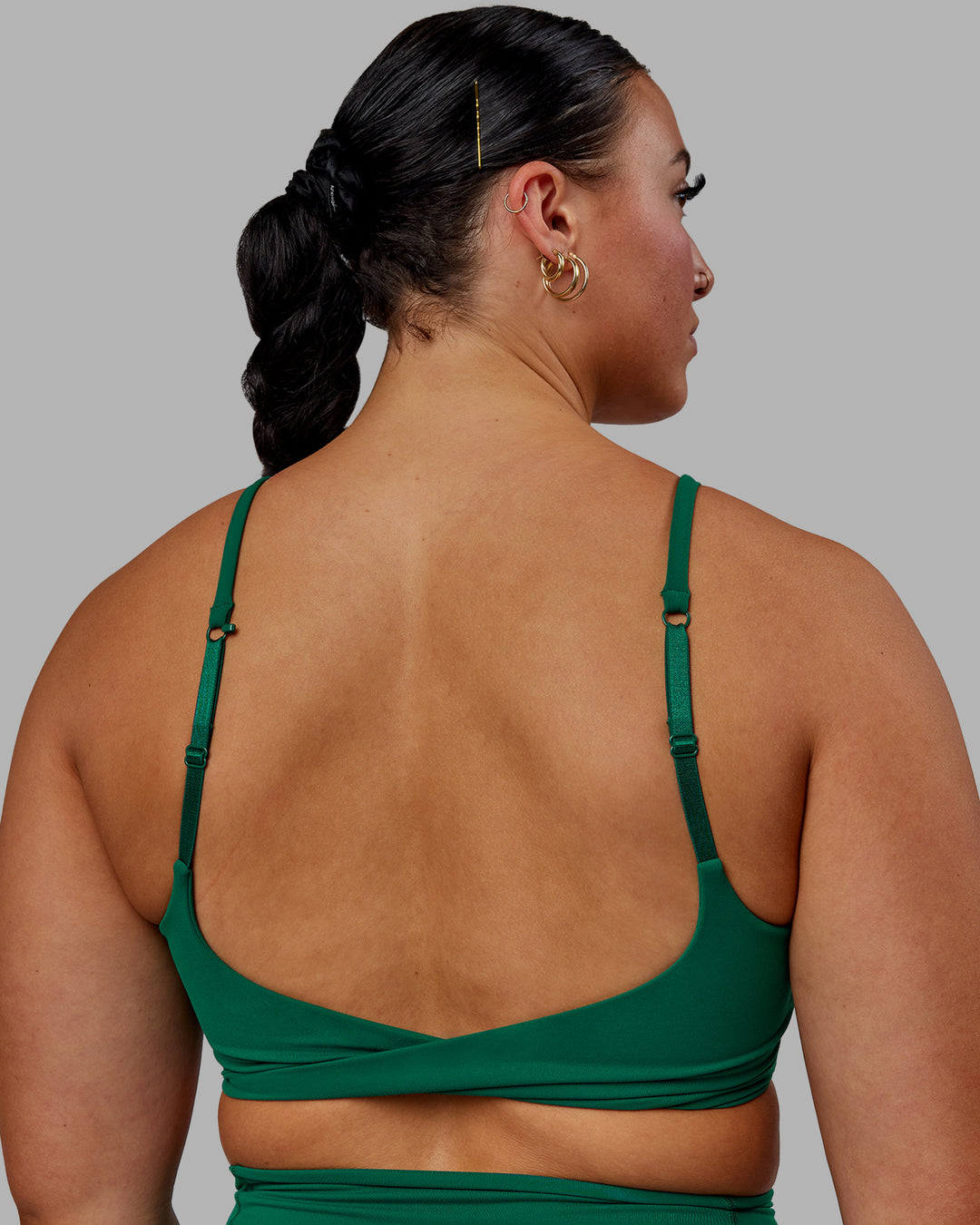 Woman wearing Twist Sports Bra - Malachite