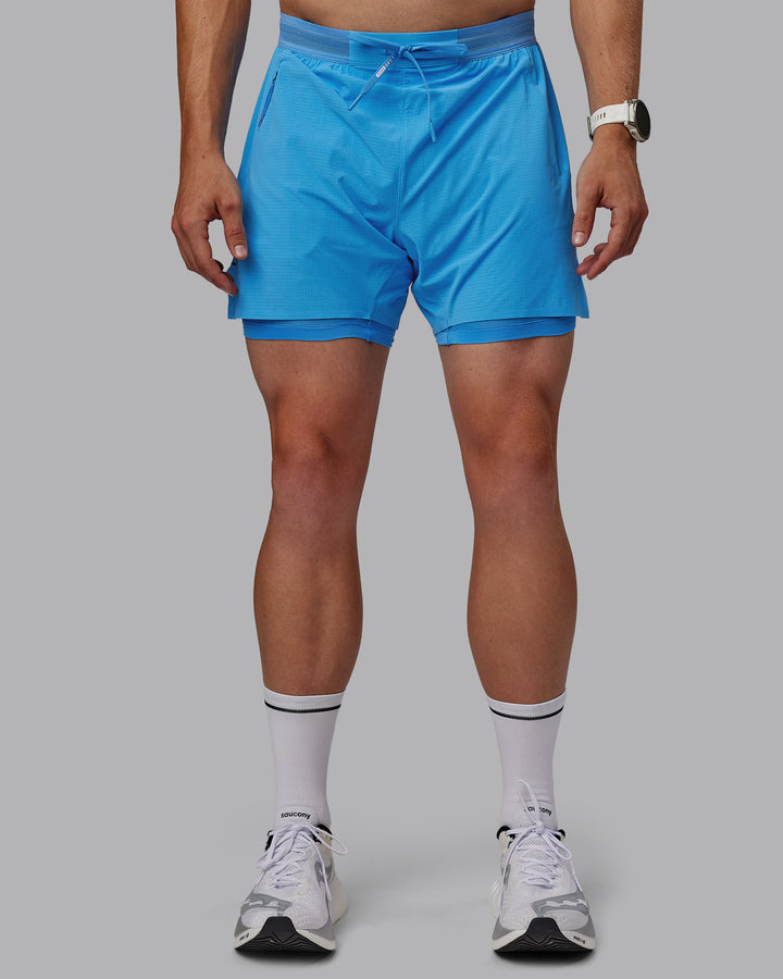 Man wearing UltraAir 5&quot; Lined Performance Shorts - Azure Blue
