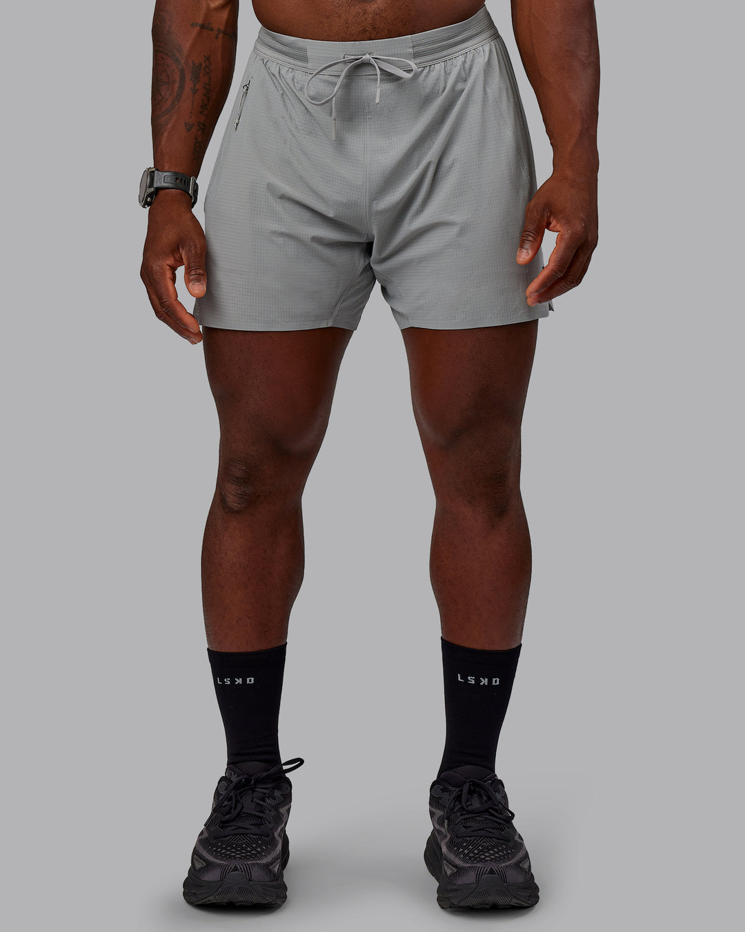 Man wearing UltraAir 5&quot; Lined Performance Shorts - Circular Grey