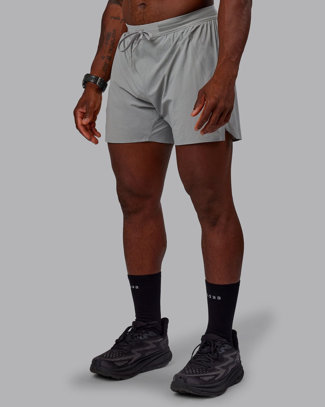 Man wearing UltraAir 5&quot; Lined Performance Shorts - Circular Grey