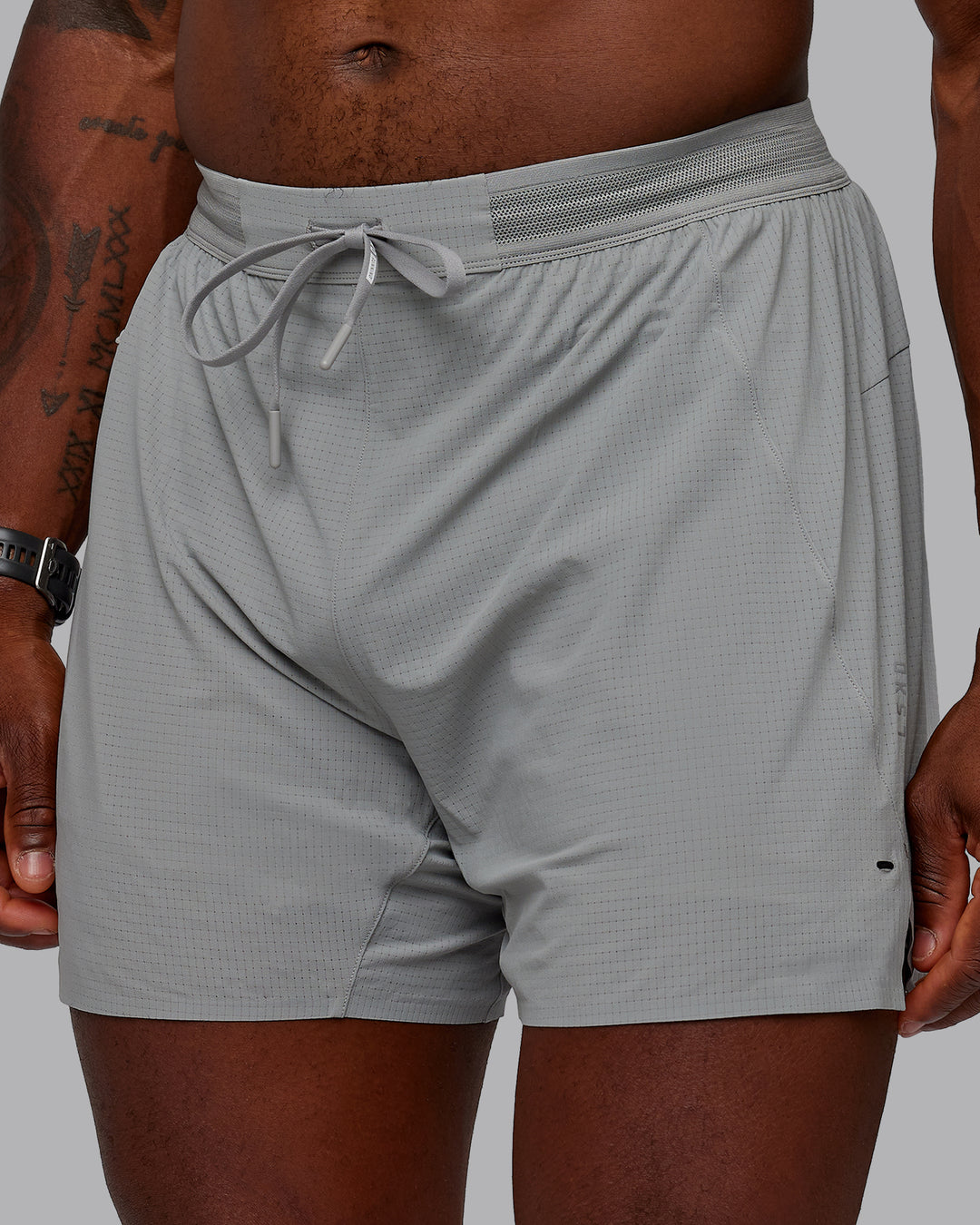 Man wearing UltraAir 5&quot; Lined Performance Shorts - Circular Grey