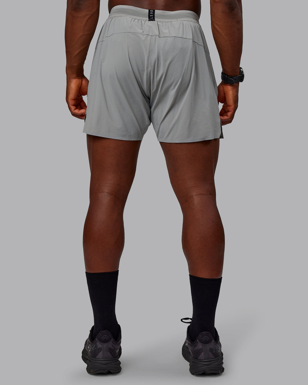 Man wearing UltraAir 5&quot; Lined Performance Shorts - Circular Grey