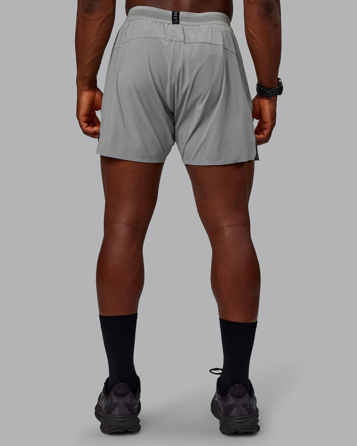 Man wearing UltraAir 5&quot; Lined Performance Shorts - Circular Grey
