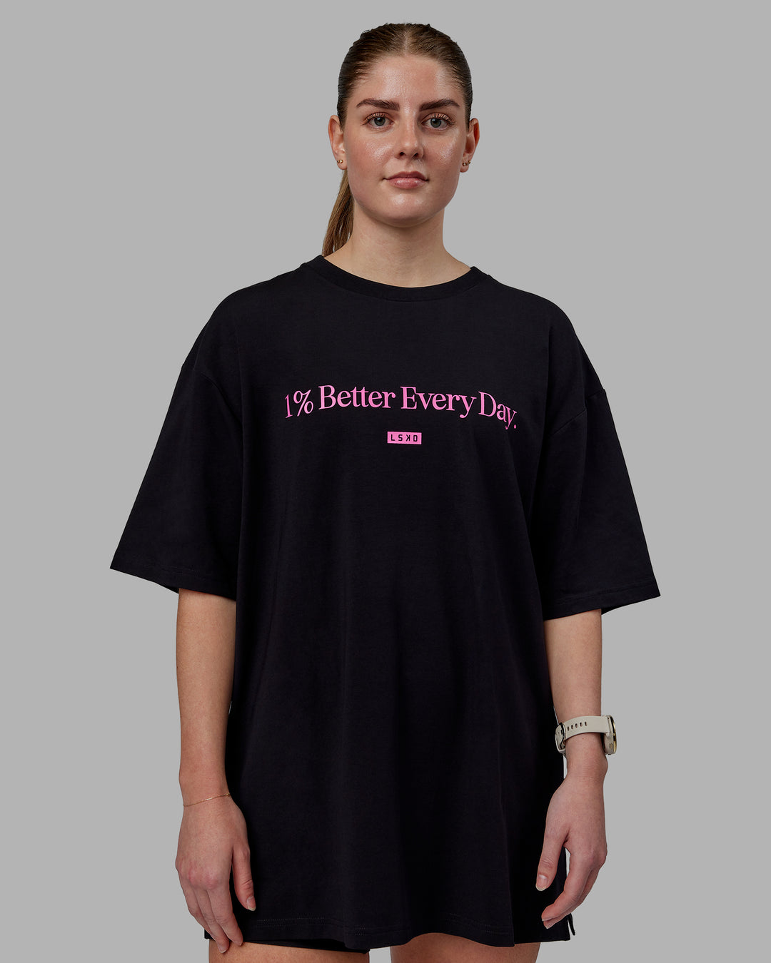 Woman wearing Unisex 1% Better FLXCotton Tee Oversize - Black-Fuschia Pink