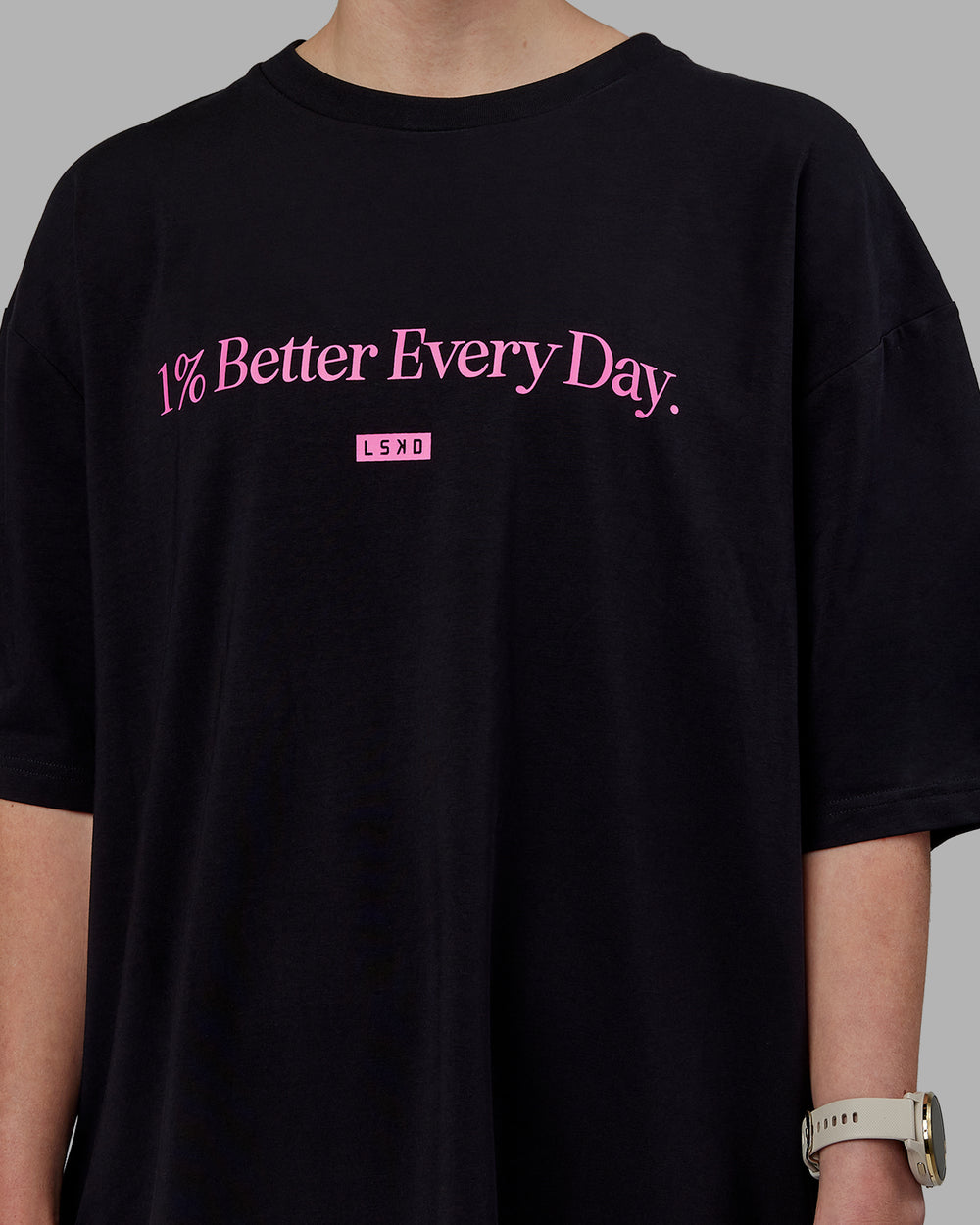 Woman wearing Unisex 1% Better FLXCotton Tee Oversize - Black-Fuschia Pink