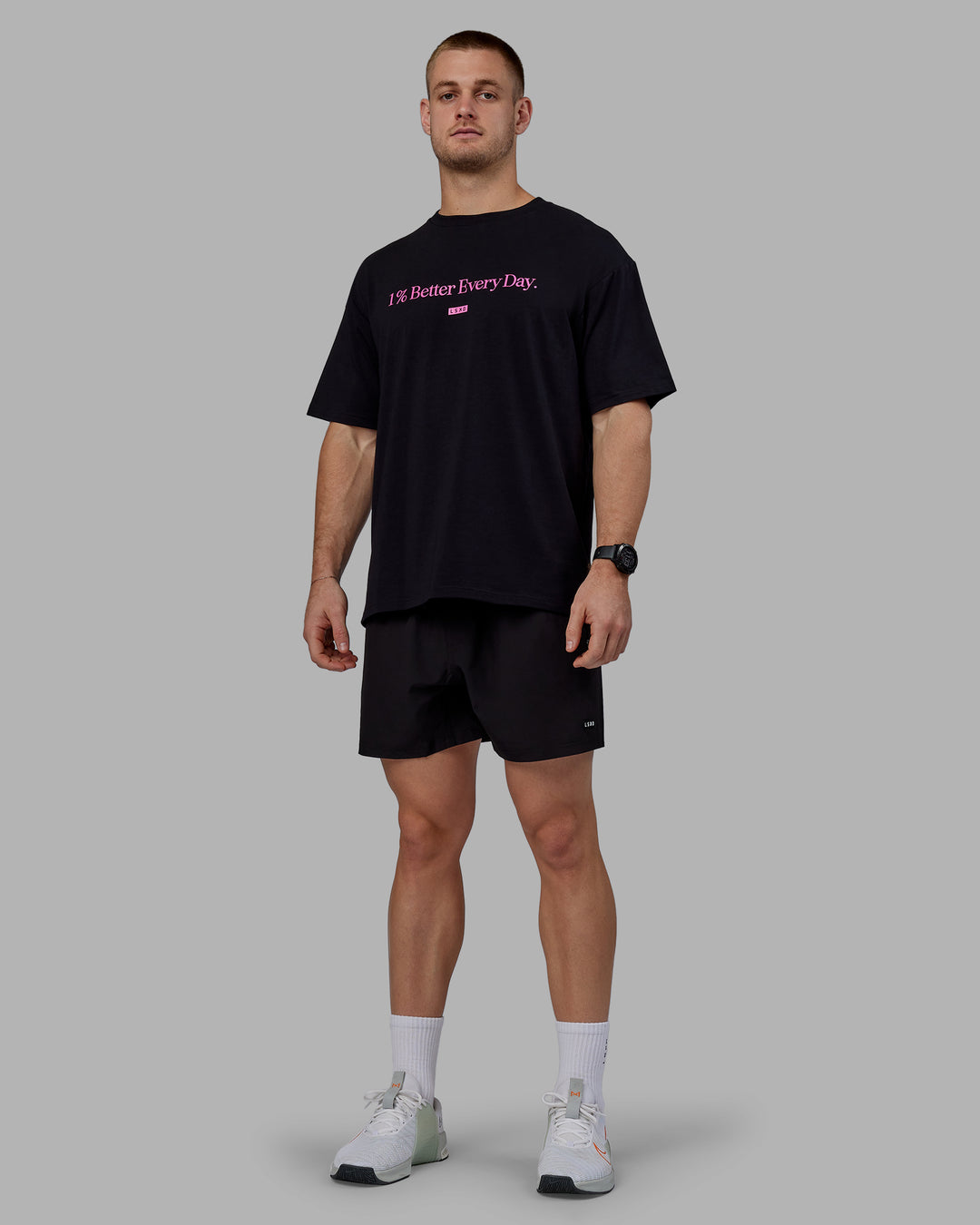 Man wearing Unisex 1% Better FLXCotton Tee Oversize - Black-Fuschia Pink