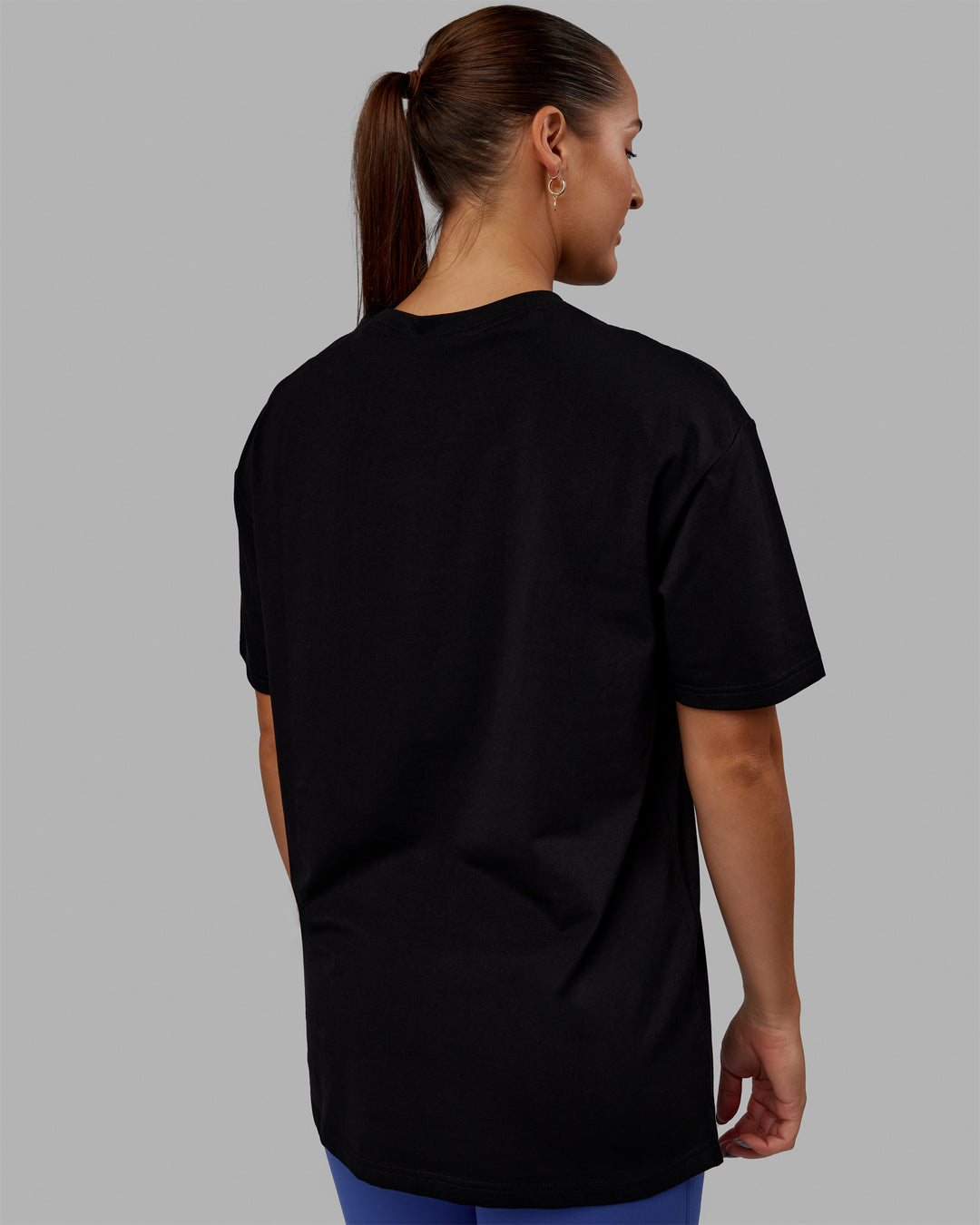 Woman wearing Unisex 1% Better FLXCotton Tee Oversize - Black-Power Cobalt