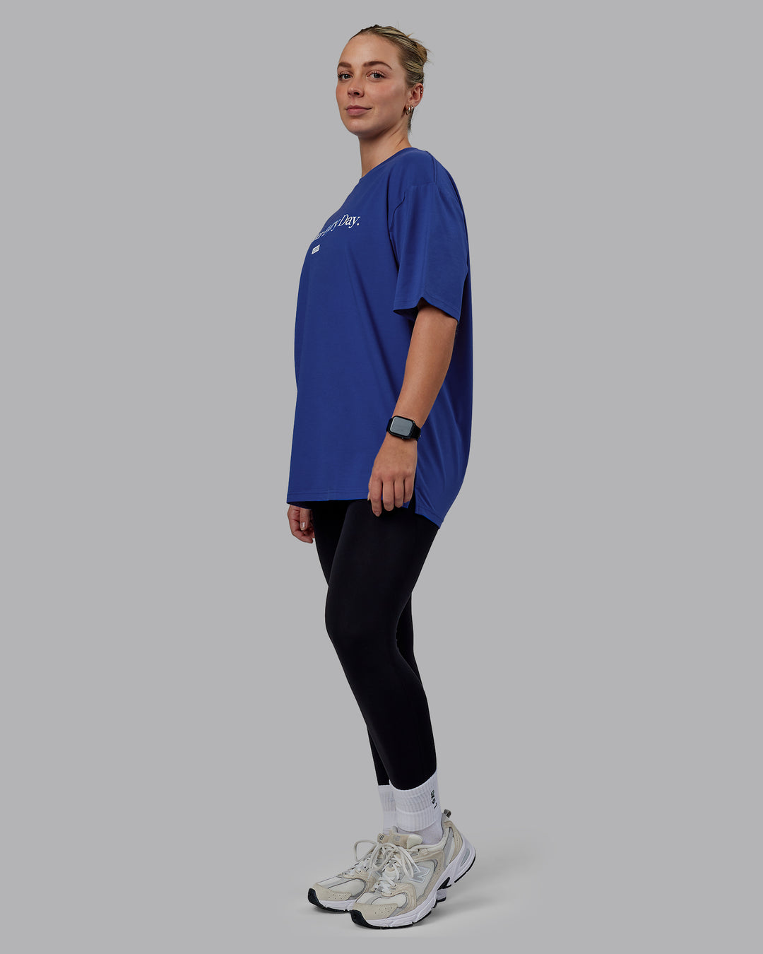 Woman wearing Unisex 1% Better FLXCotton Tee Oversize - Power Cobalt-White