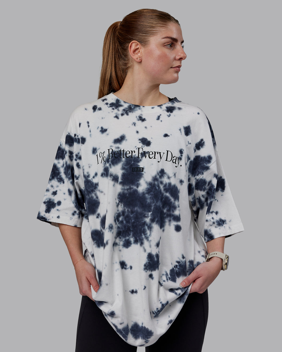 Woman wearing Unisex 1% Better Heavyweight Tee Oversize - White-Black Tie Dye