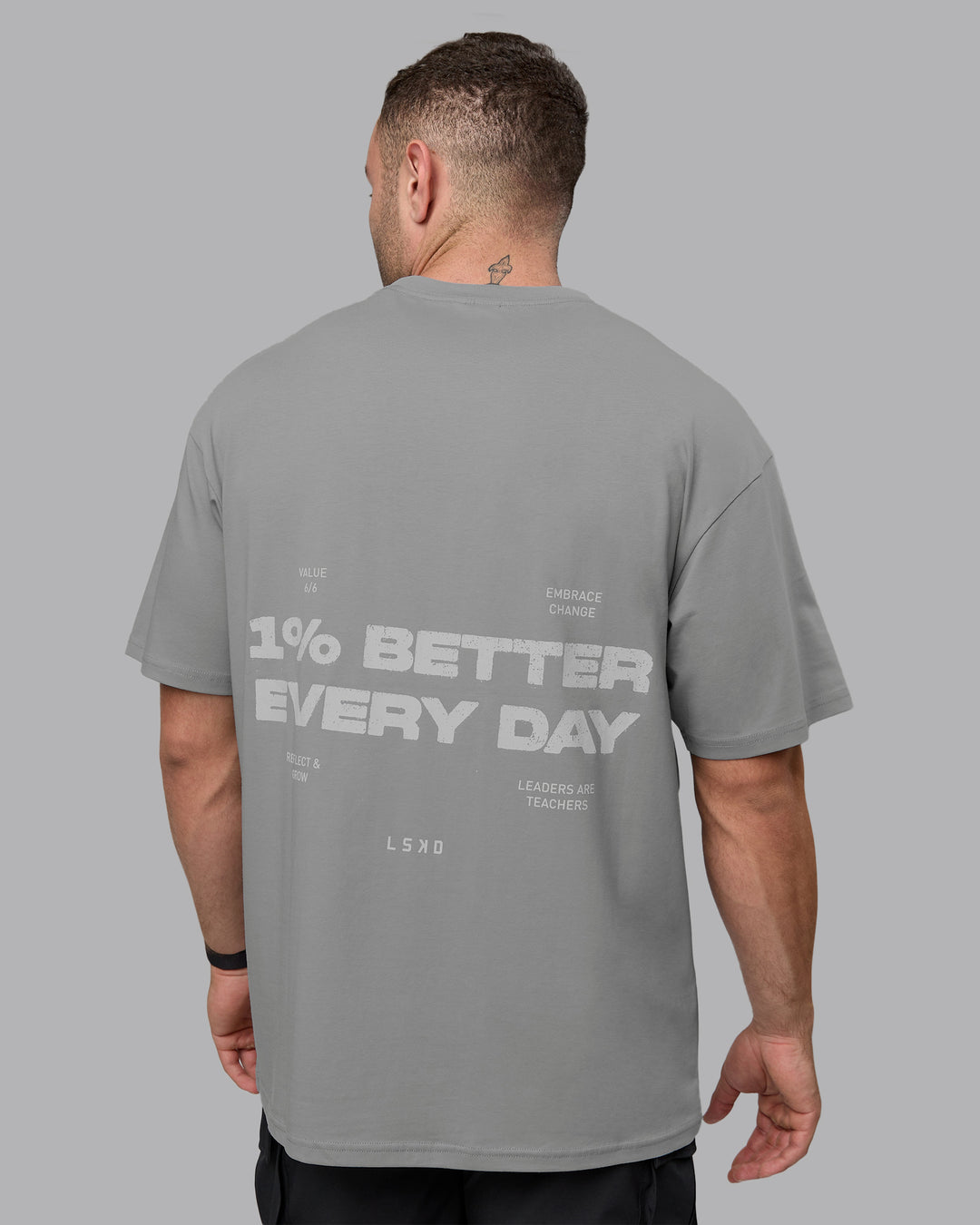 Man wearing Unisex 1% Better Value Series FLXCotton Tee Oversize - Circular Grey-White