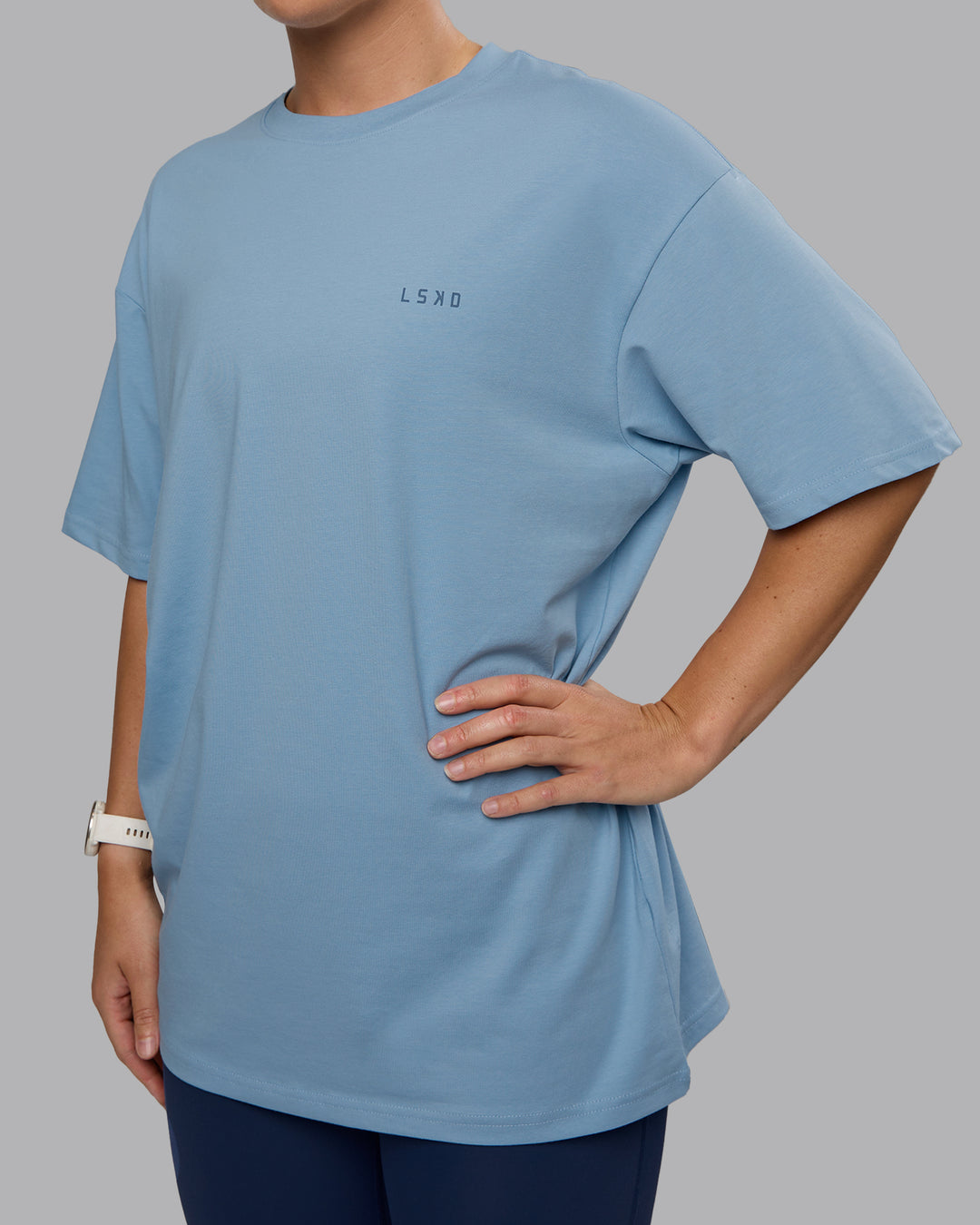 Woman wearing Unisex 1% Better Value Series FLXCotton Tee Oversize - Glacier Lake-Indigo