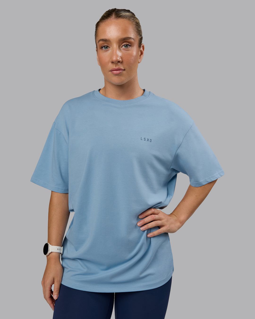 Woman wearing Unisex 1% Better Value Series FLXCotton Tee Oversize - Glacier Lake-Indigo