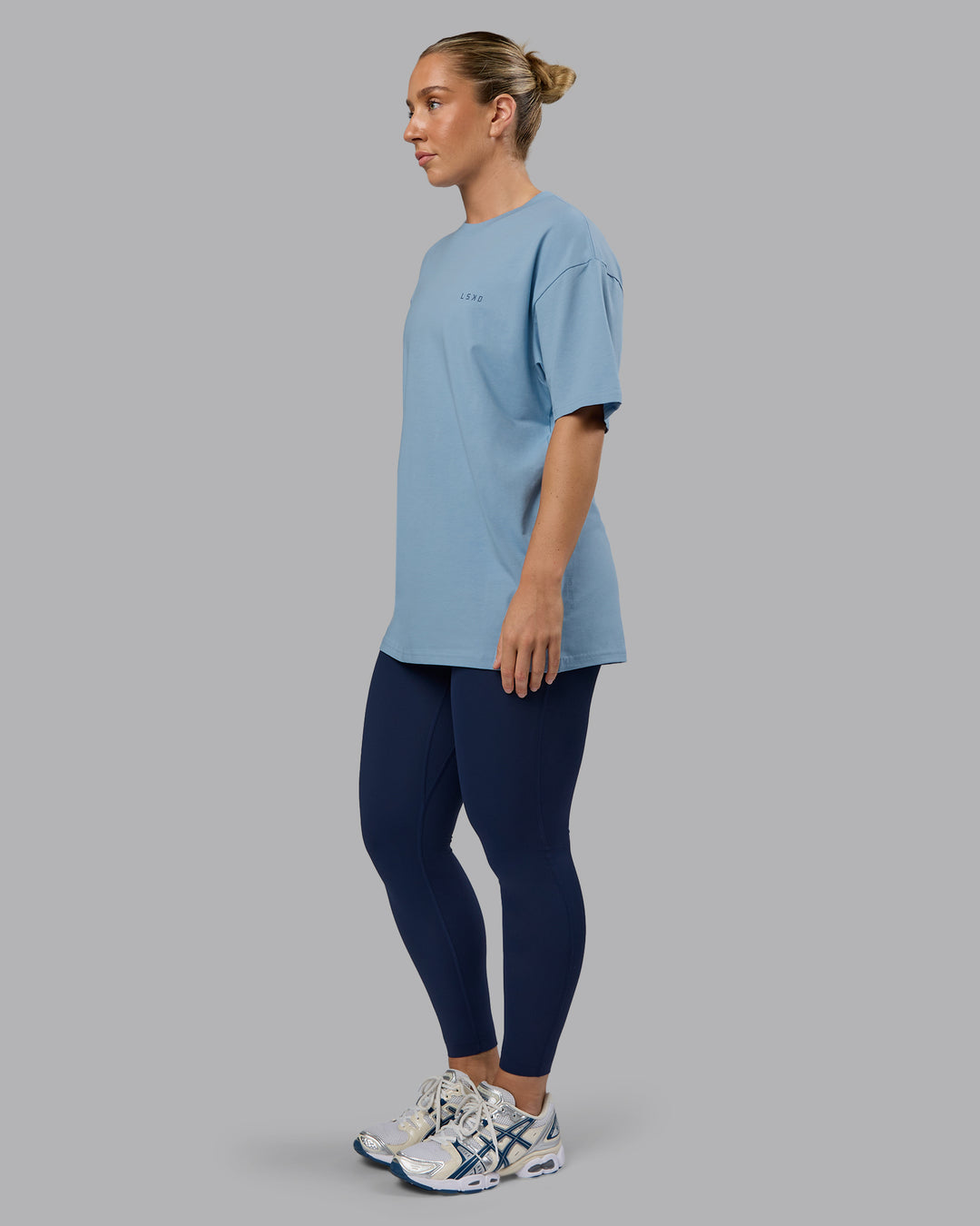 Woman wearing Unisex 1% Better Value Series FLXCotton Tee Oversize - Glacier Lake-Indigo