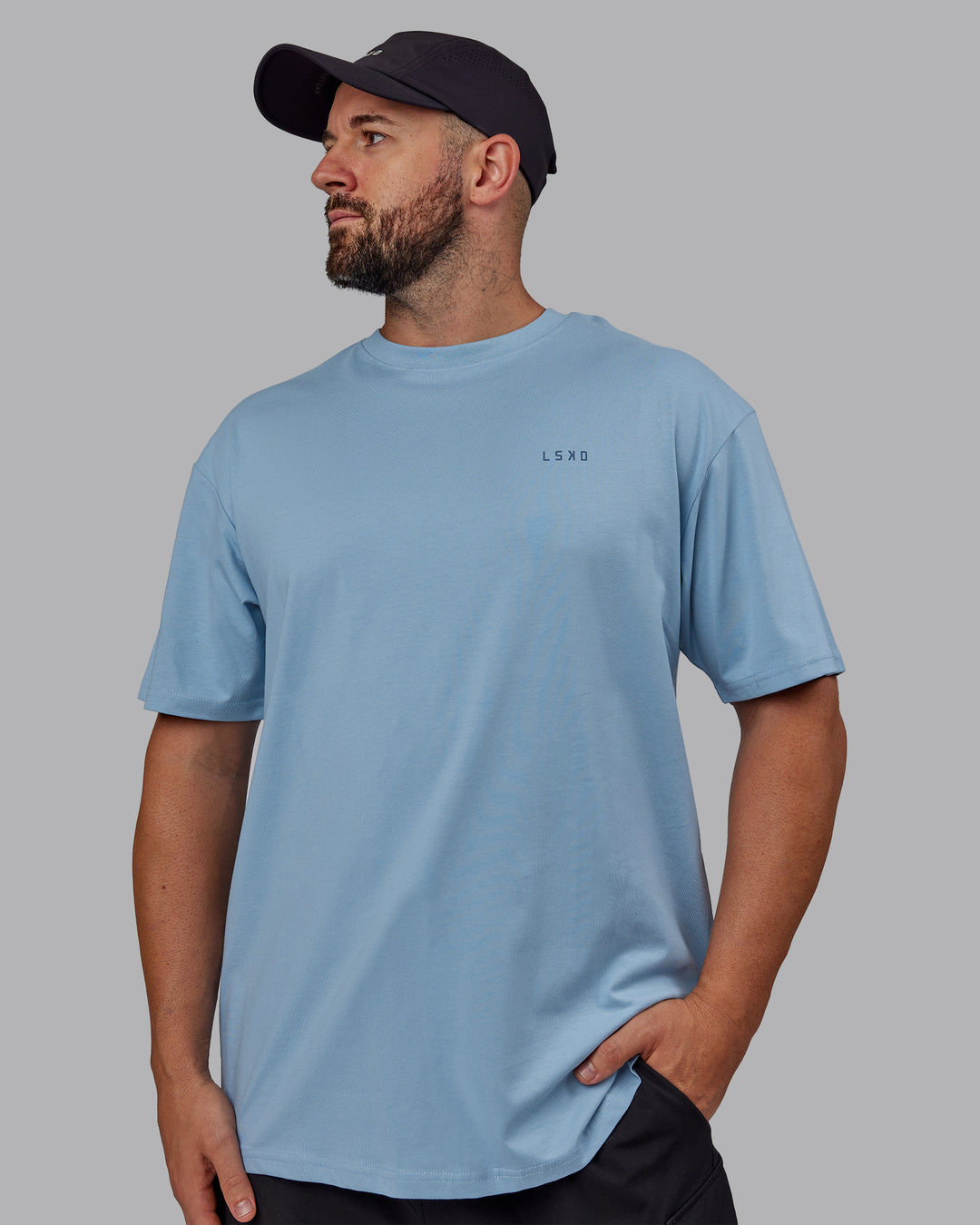 Man wearing Unisex 1% Better Value Series FLXCotton Tee Oversize - Glacier Lake-Indigo