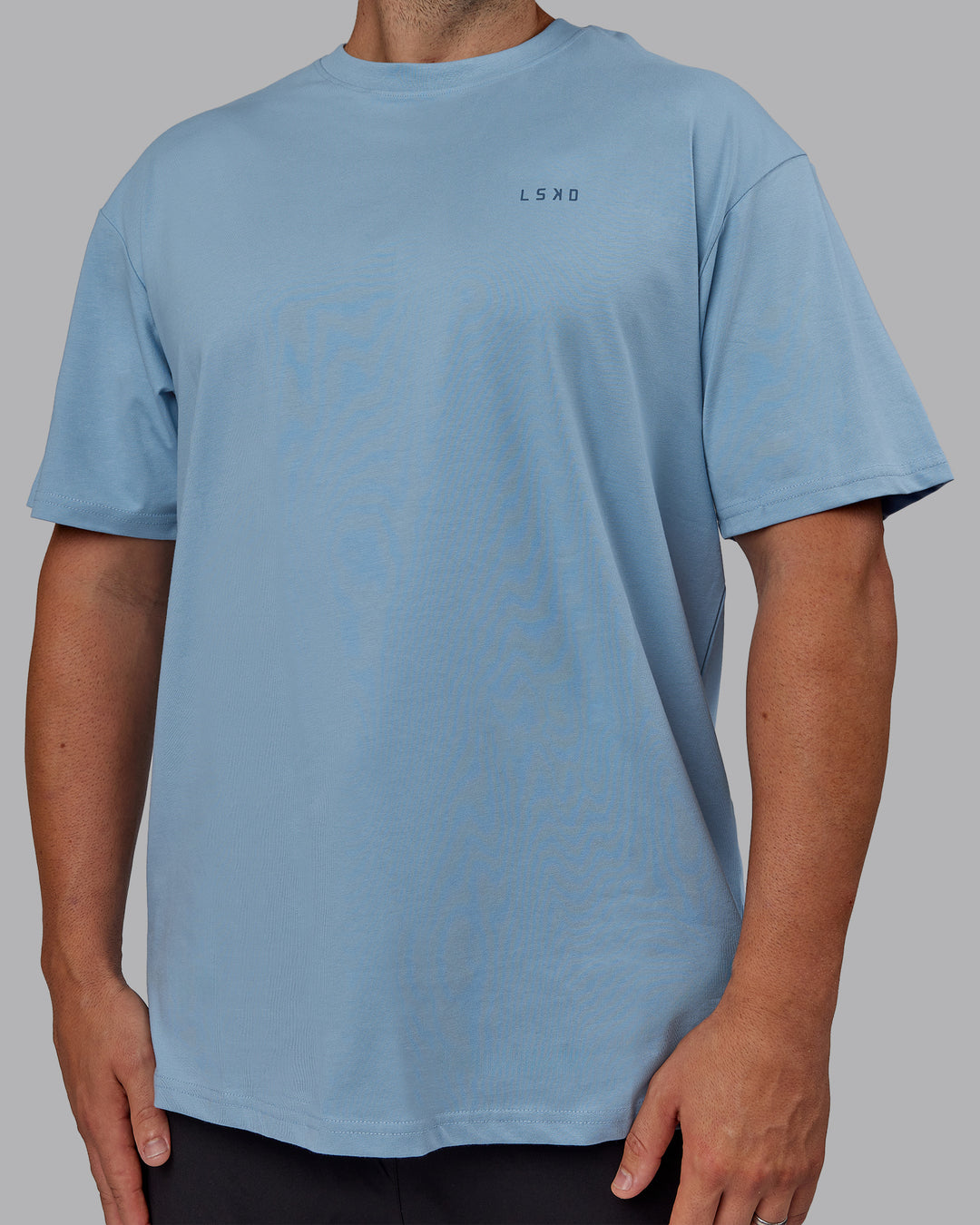 Man wearing Unisex 1% Better Value Series FLXCotton Tee Oversize - Glacier Lake-Indigo