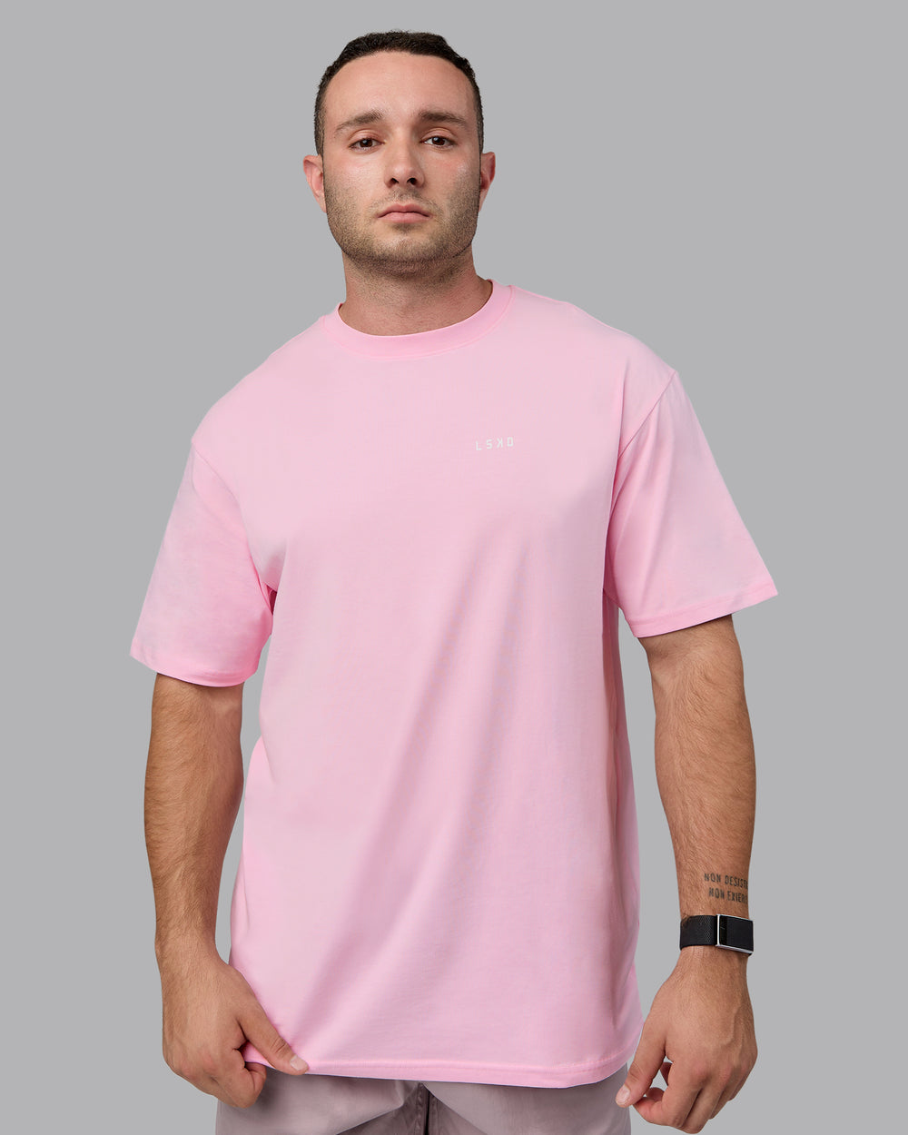 Man wearing Unisex 1% Better Value Series FLXCotton Tee Oversize - Pale Pink-White