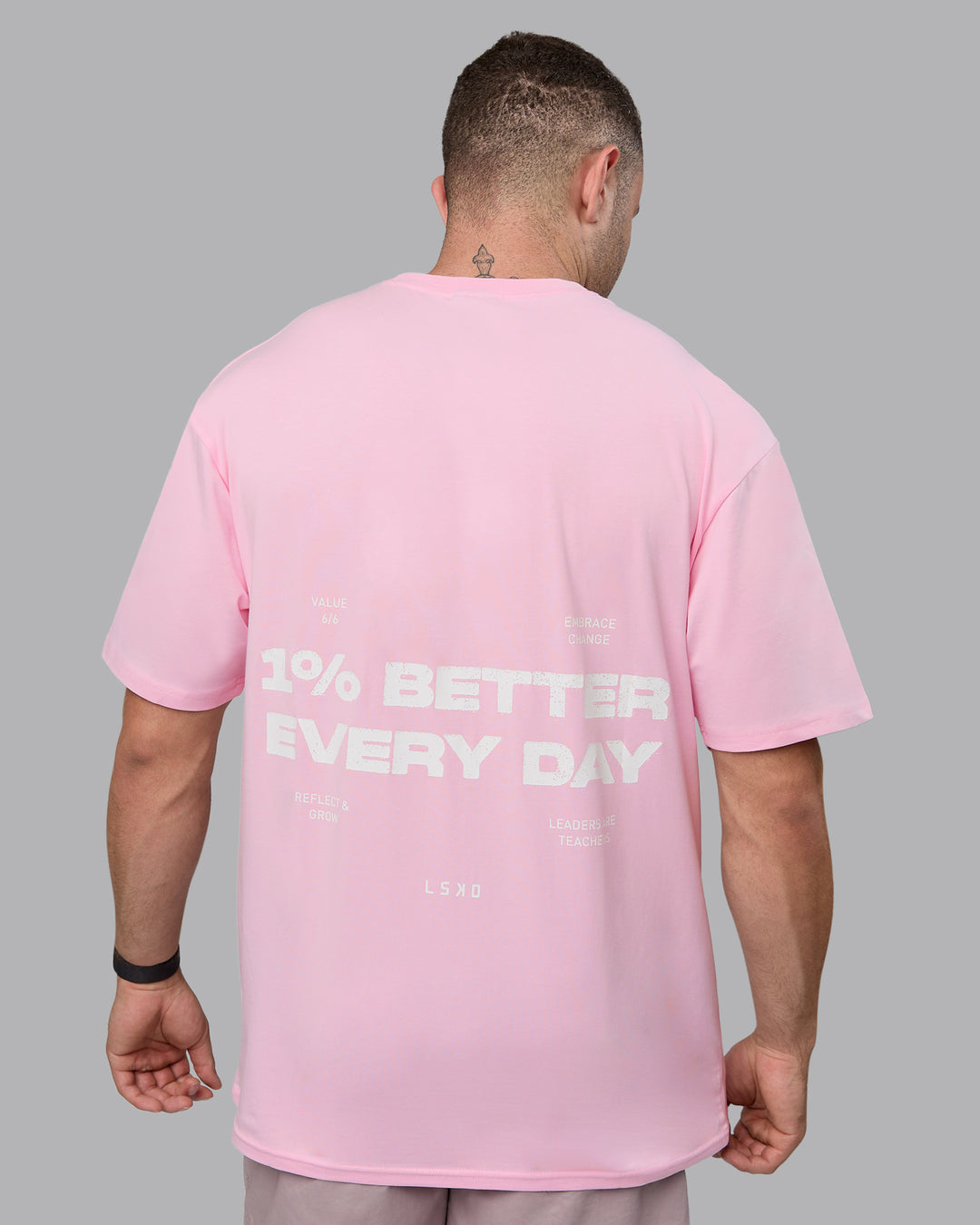 Man wearing Unisex 1% Better Value Series FLXCotton Tee Oversize - Pale Pink-White