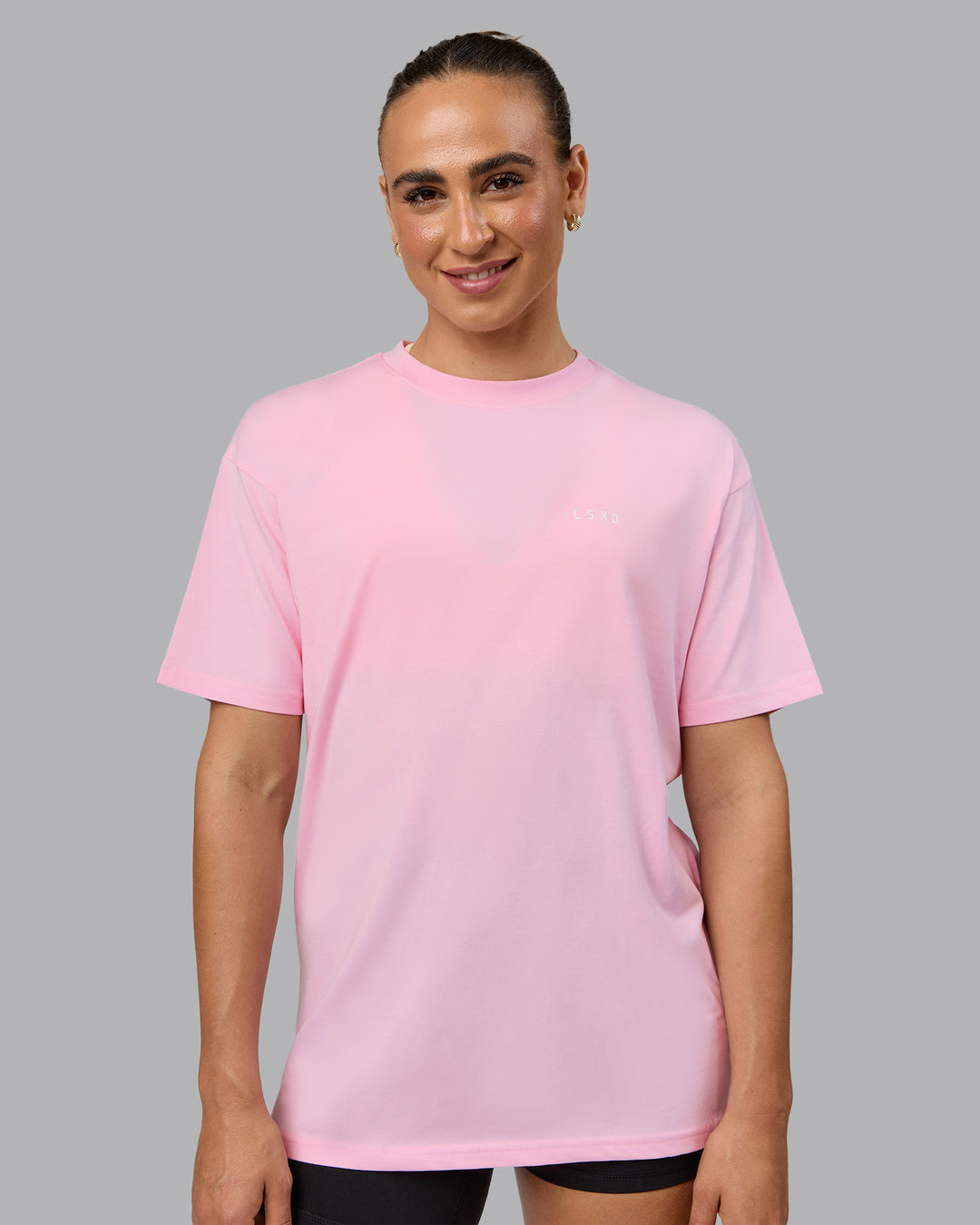 Woman wearing Unisex 1% Better Value Series FLXCotton Tee Oversize - Pale Pink-White