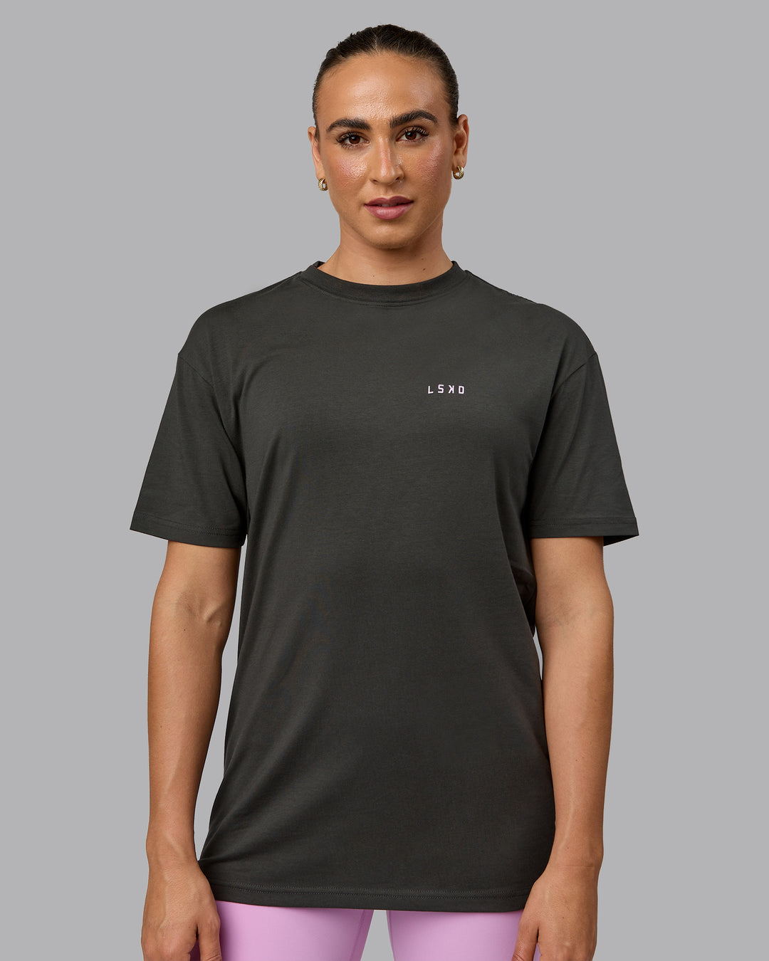 Woman wearing Unisex 1% Better Value Series FLXCotton Tee Oversize - Pirate Black-Light Violet