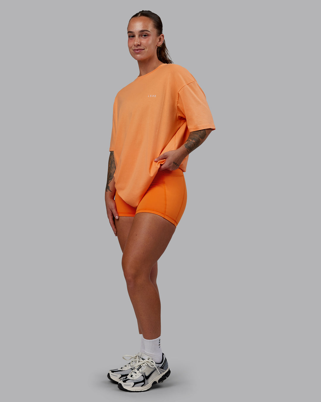 Woman wearing Unisex 1% Better Value Series FLXCotton Tee Oversize - Sorbet-Festival Bloom