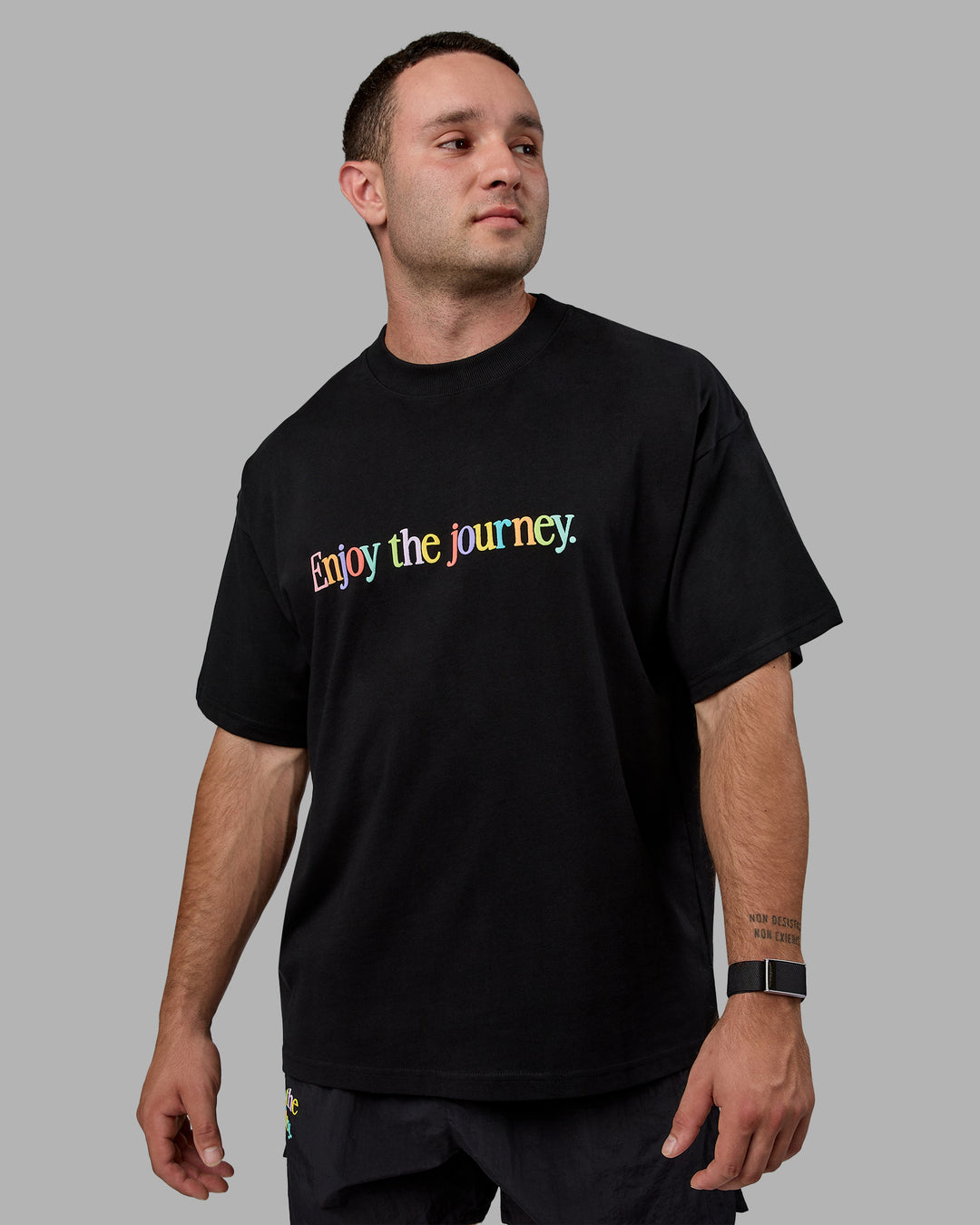 Man wearing Unisex Enjoy The Journey Heavyweight Tee Oversize - Black-Multi