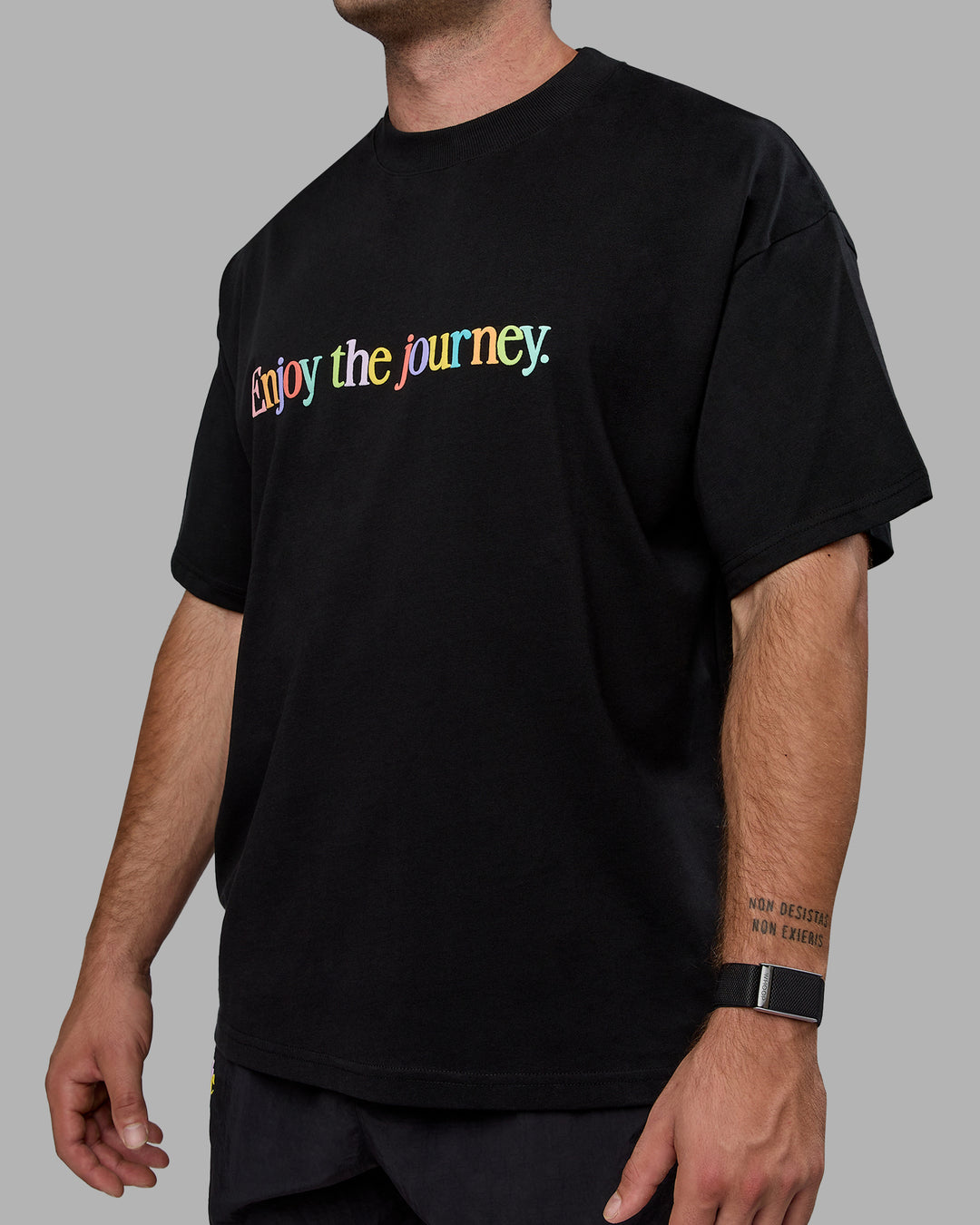 Man wearing Unisex Enjoy The Journey Heavyweight Tee Oversize - Black-Multi