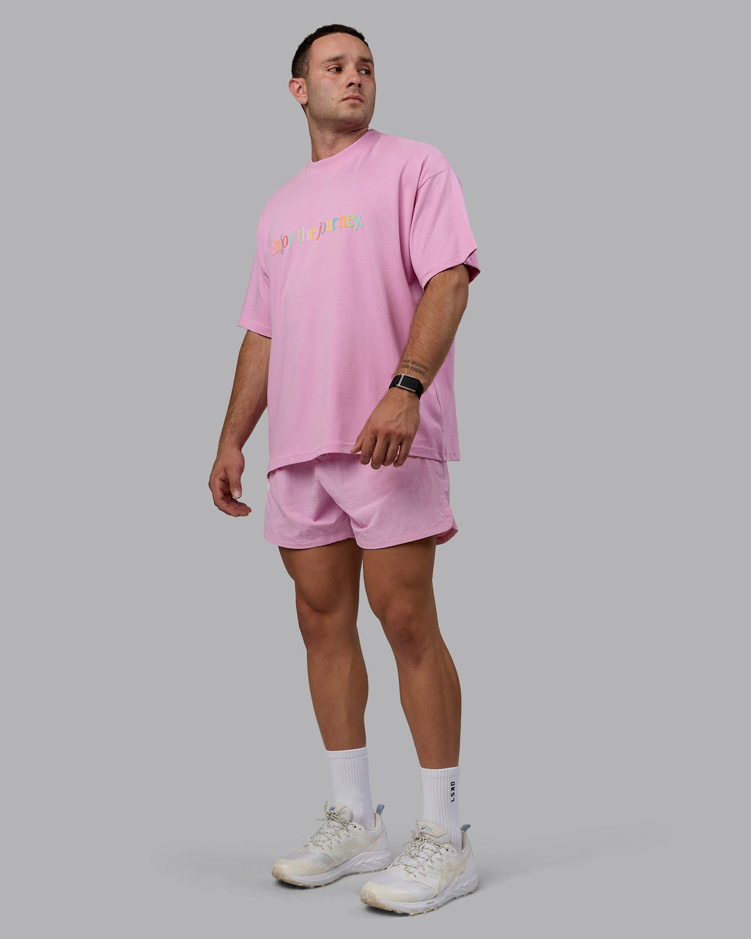 Man wearing Unisex Enjoy The Journey Heavyweight Tee Oversize - Bubblegum-Multi