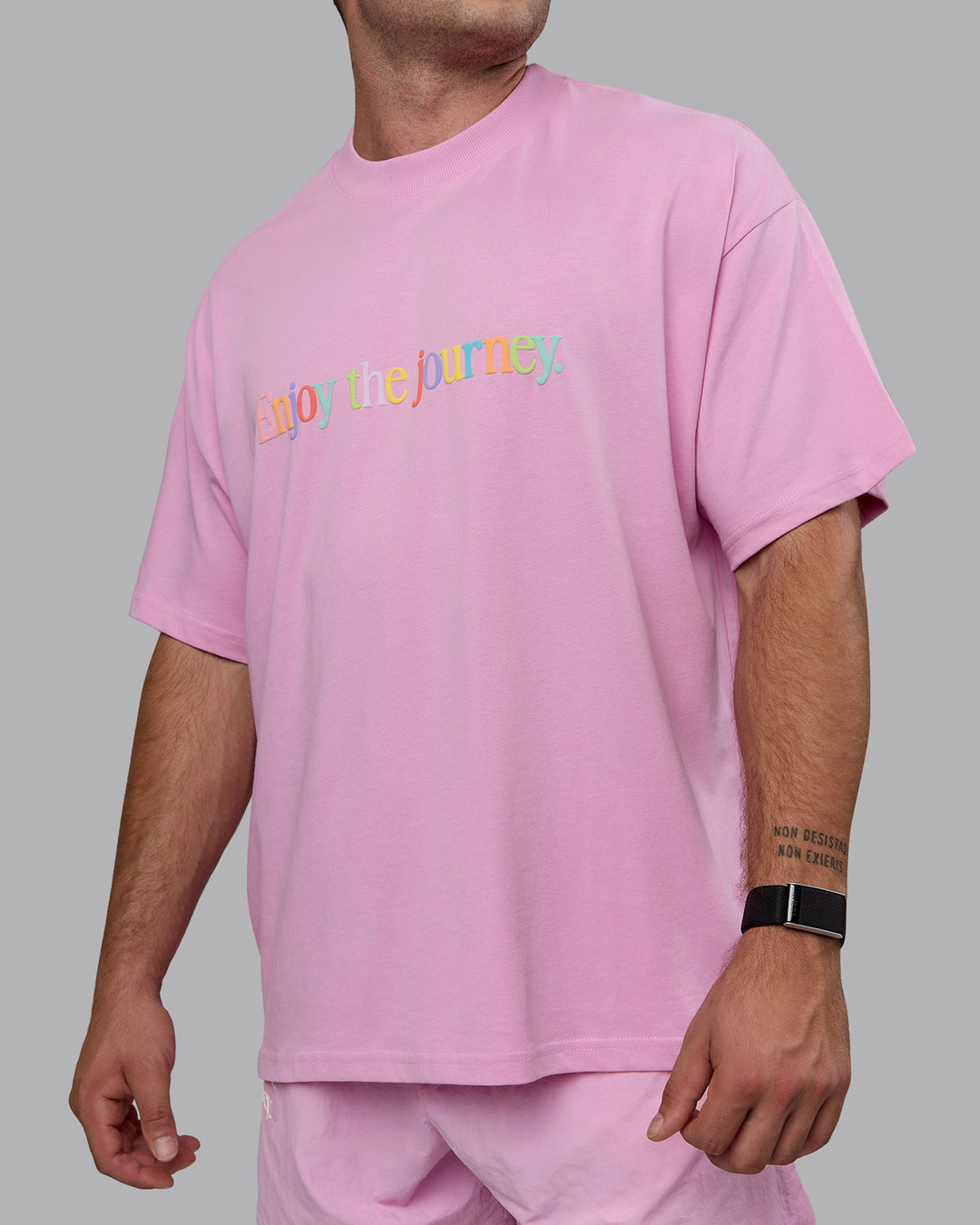 Man wearing Unisex Enjoy The Journey Heavyweight Tee Oversize - Bubblegum-Multi