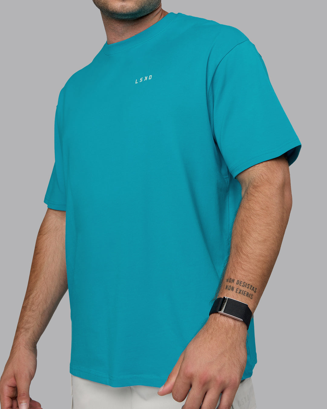 Man wearing Unisex Enjoy the Journey Value Series FLXCotton Tee Oversize - Bluebird-Surf Spray