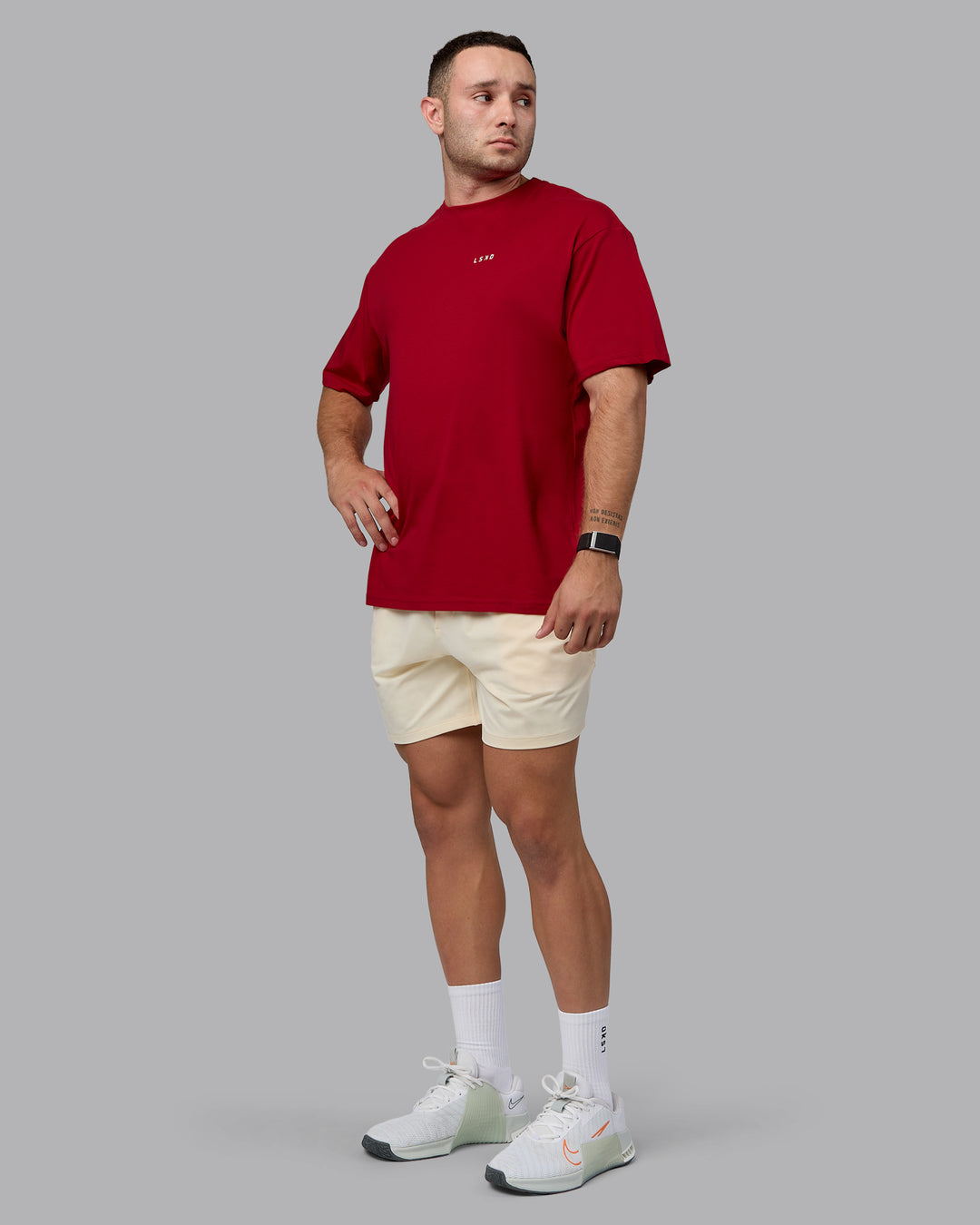 Man wearing Unisex Enjoy the Journey Value Series FLXCotton Tee Oversize - Cherry Red-Ivory