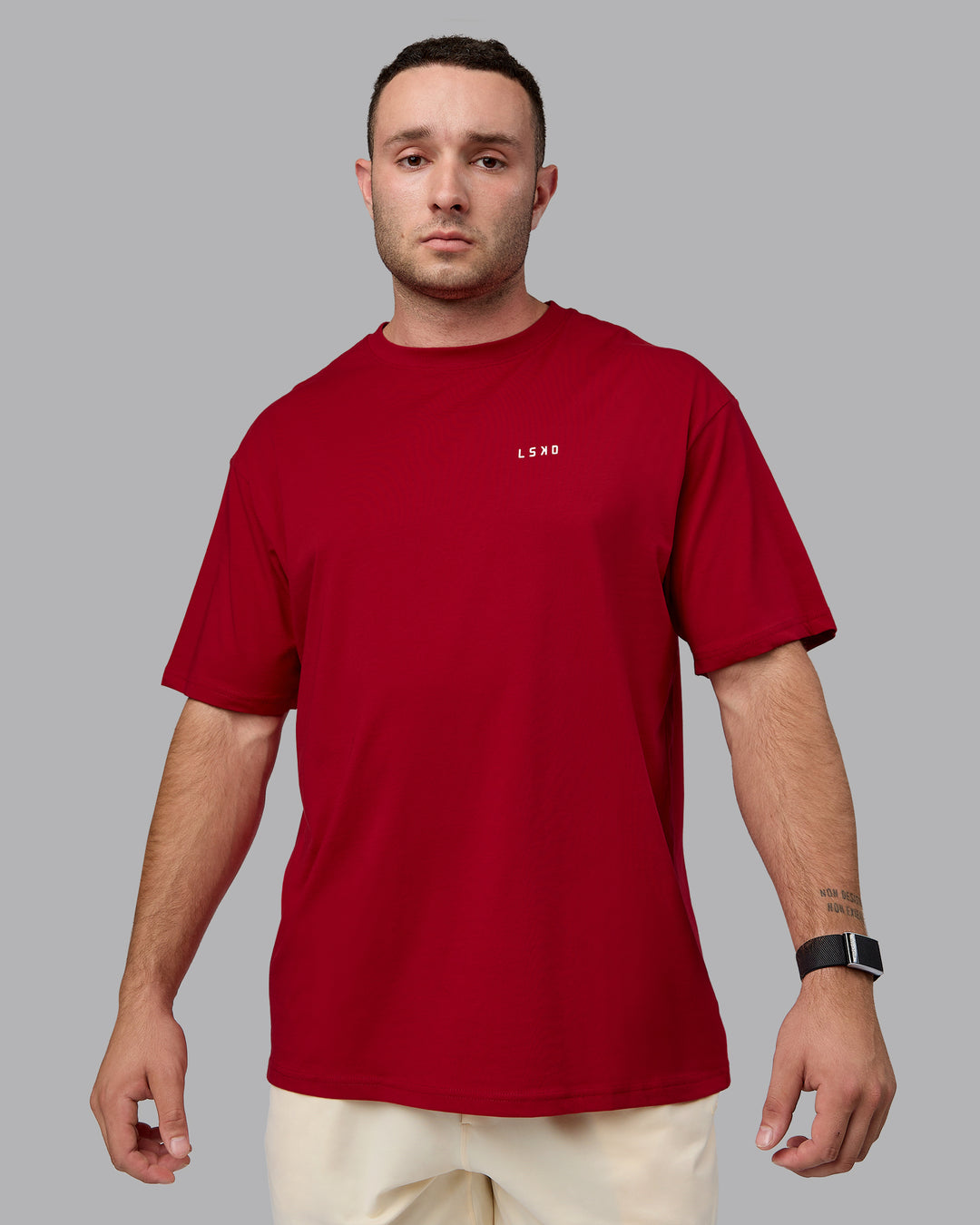 Man wearing Unisex Enjoy the Journey Value Series FLXCotton Tee Oversize - Cherry Red-Ivory