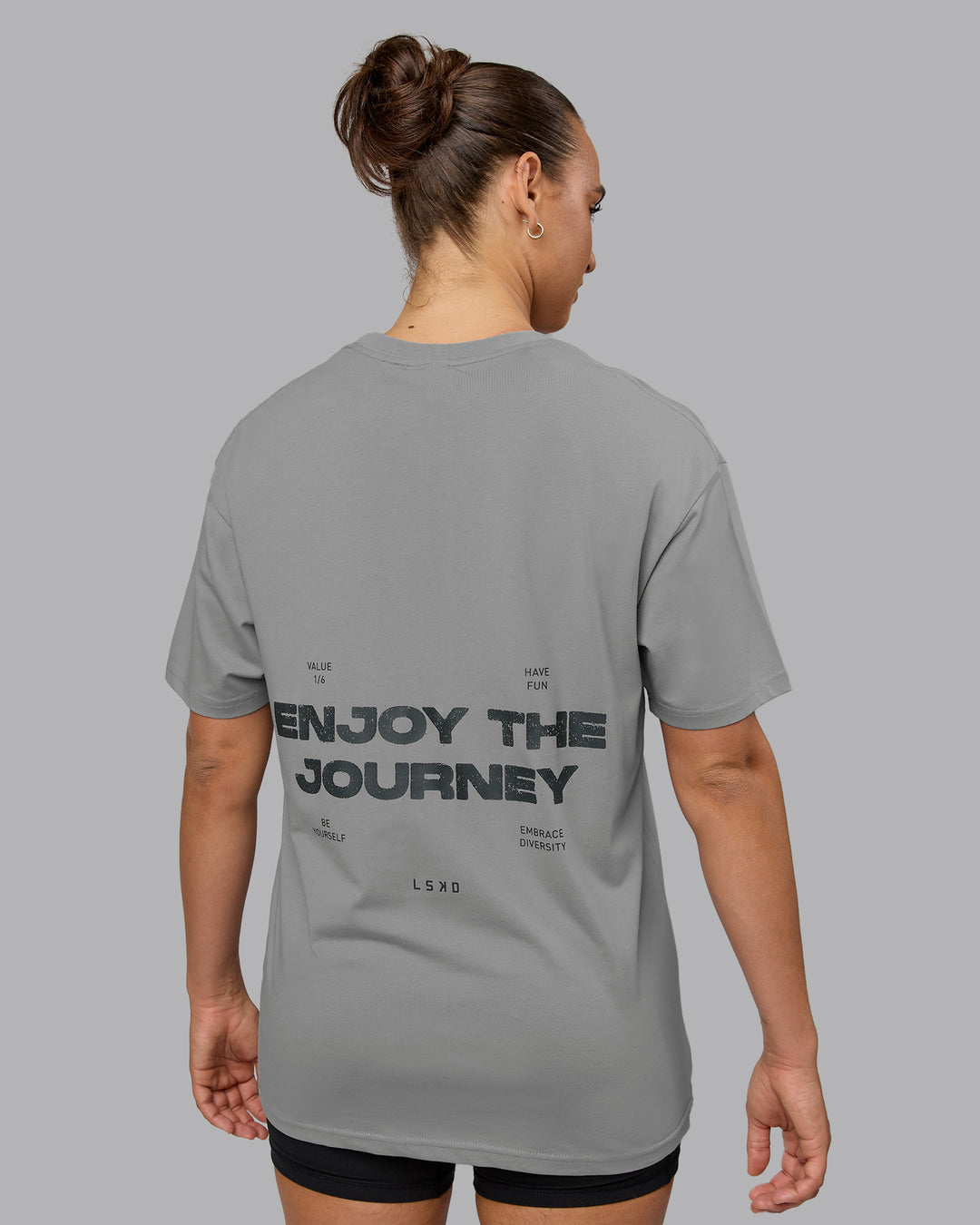 Woman wearing Unisex Enjoy the Journey Value Series FLXCotton Tee Oversize - Circular Grey-Pirate Black