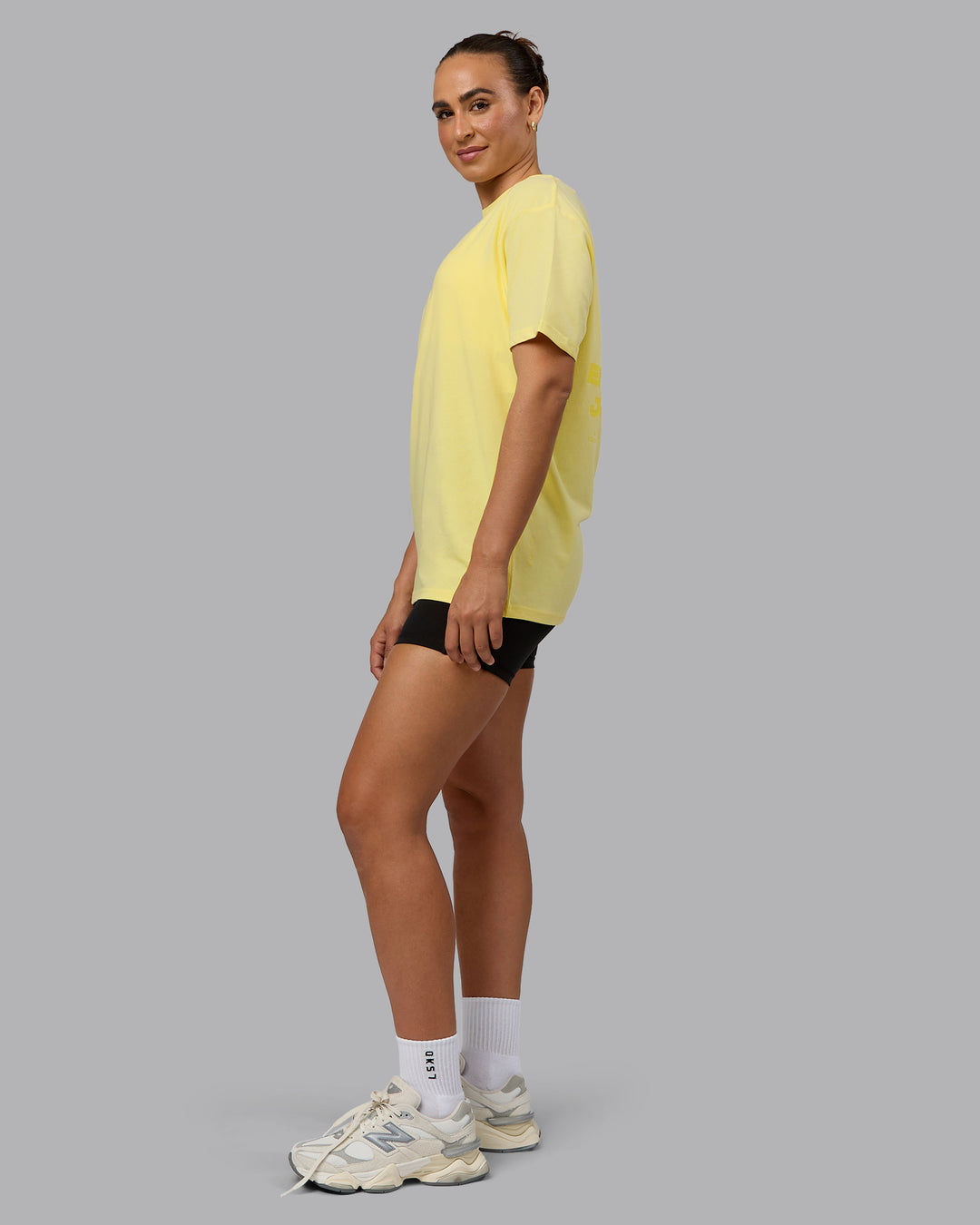 Woman wearing Unisex Enjoy the Journey Value Series FLXCotton Tee Oversize - Pale Yellow-Sundress