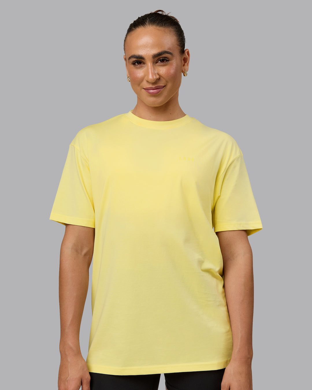 Woman wearing Unisex Enjoy the Journey Value Series FLXCotton Tee Oversize - Pale Yellow-Sundress