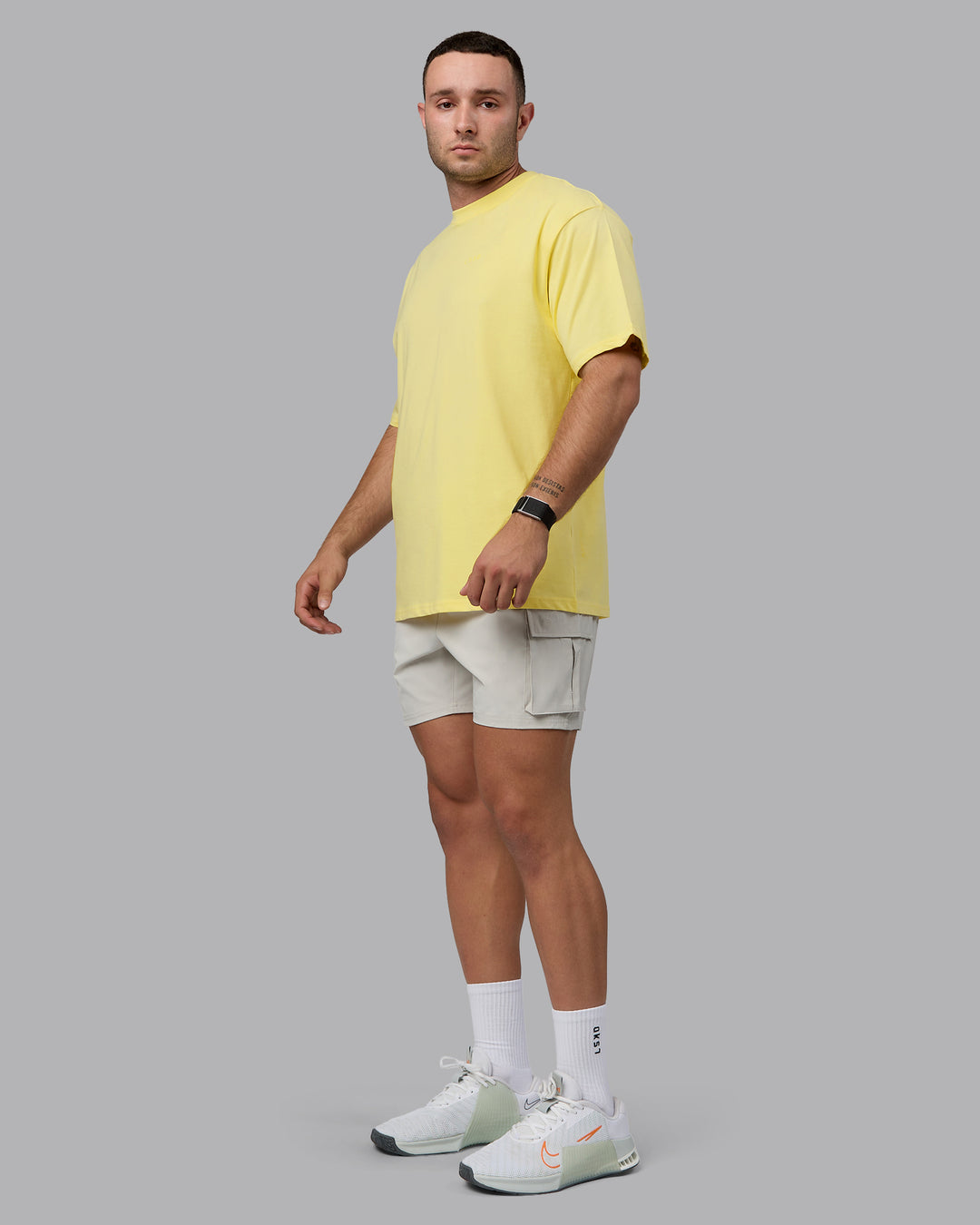 Man wearing Unisex Enjoy the Journey Value Series FLXCotton Tee Oversize - Pale Yellow-Sundress