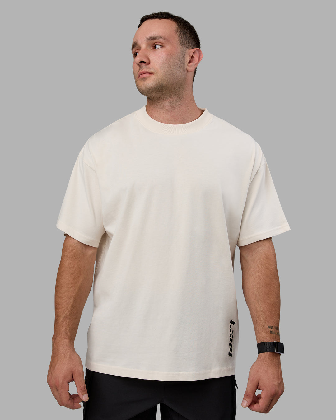 Man wearing Unisex Fail Forward Heavyweight FLXCotton Tee Oversize - Off White-Black