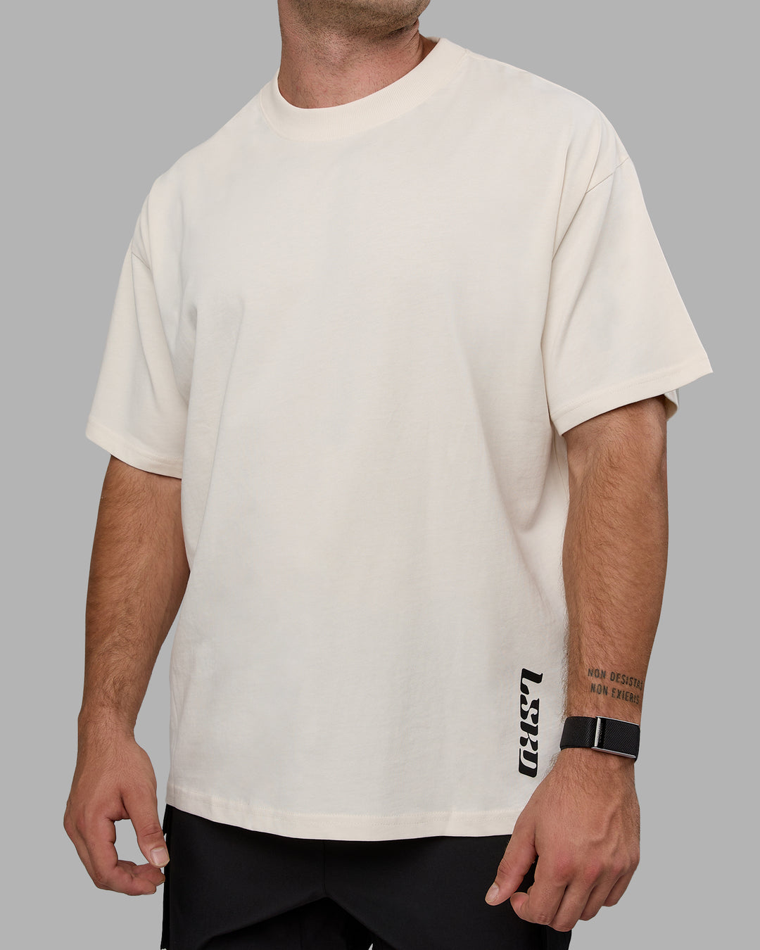 Man wearing Unisex Fail Forward Heavyweight FLXCotton Tee Oversize - Off White-Black