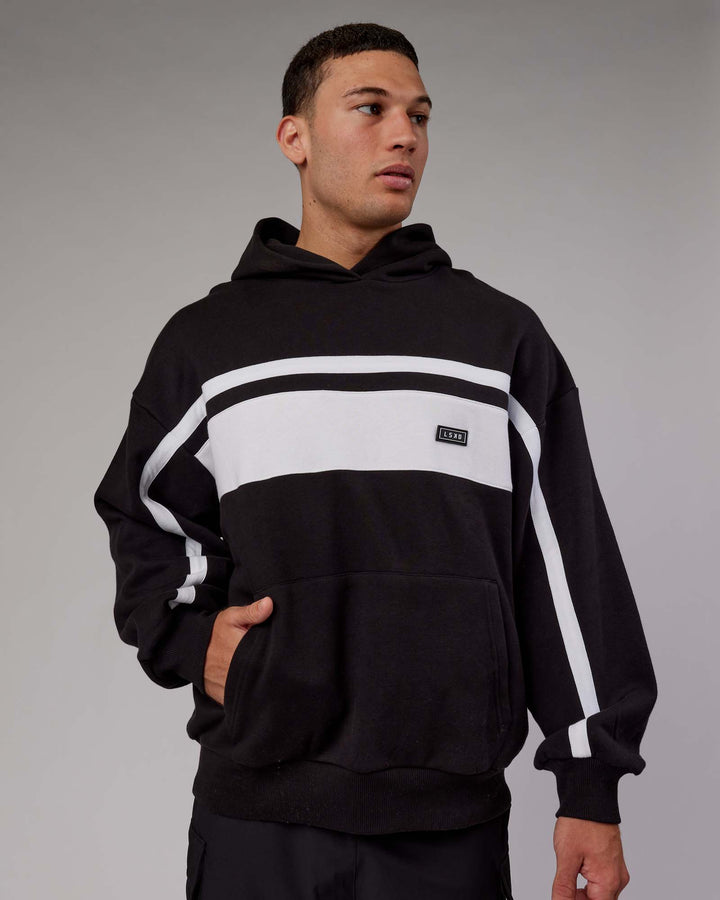 Man wearing Unisex Intercept Hoodie Oversize - Black-White
